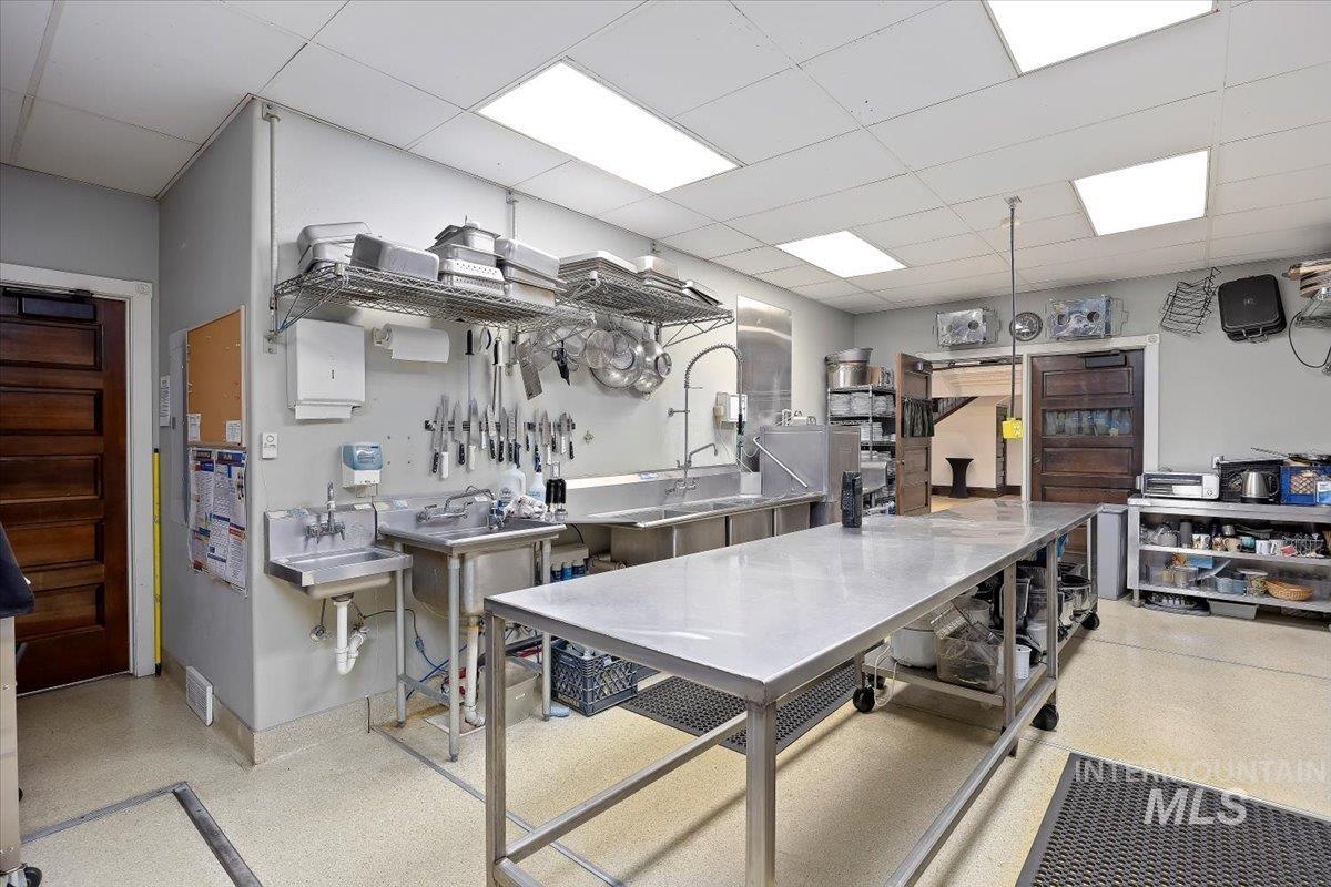 Kitchen featuring a paneled ceiling and a sink