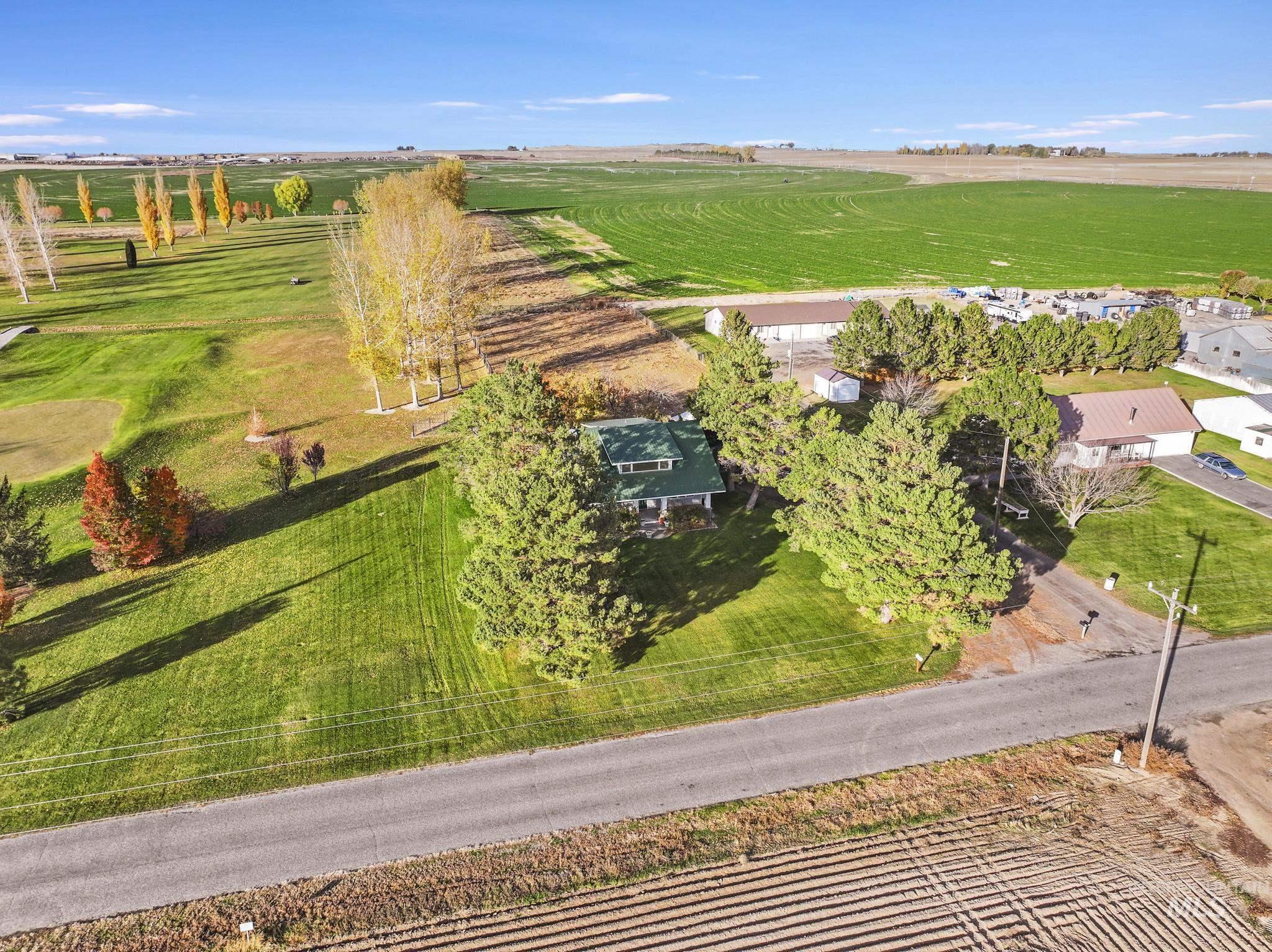Aerial view of property's location featuring rural landscape and large plots for crops