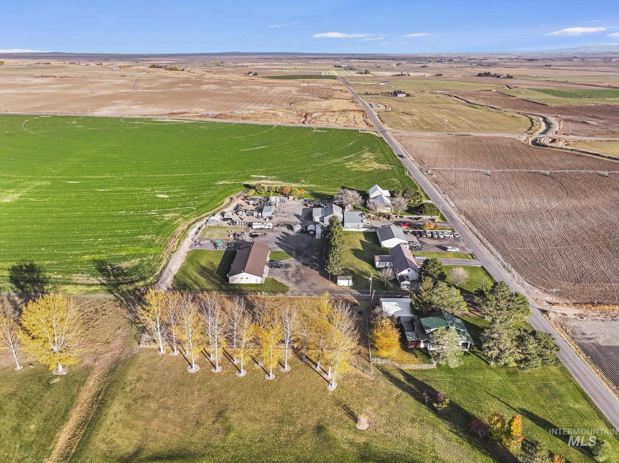 Aerial overview of property's location with rural landscape and farmland