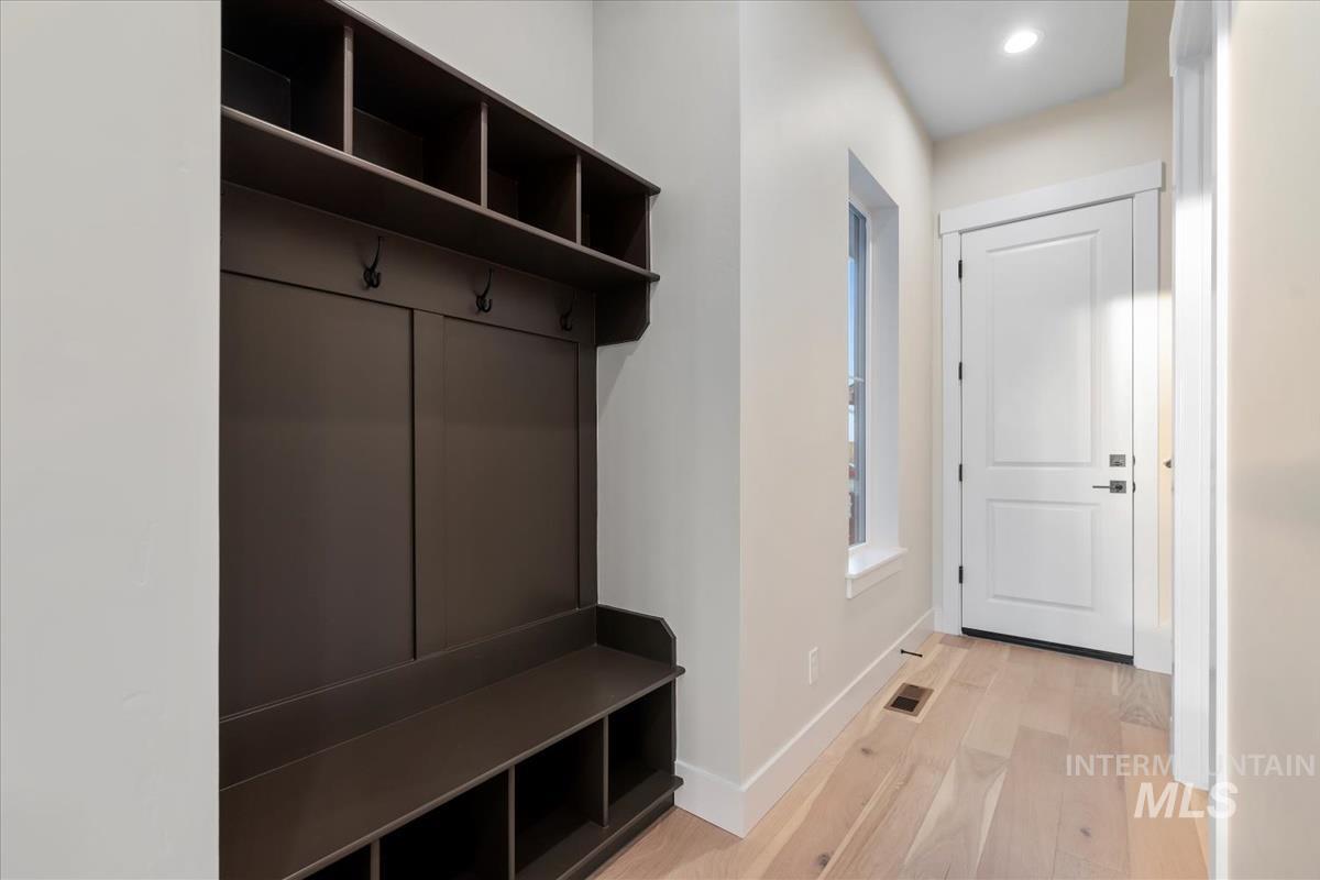 Mudroom with light wood-style floors and recessed lighting