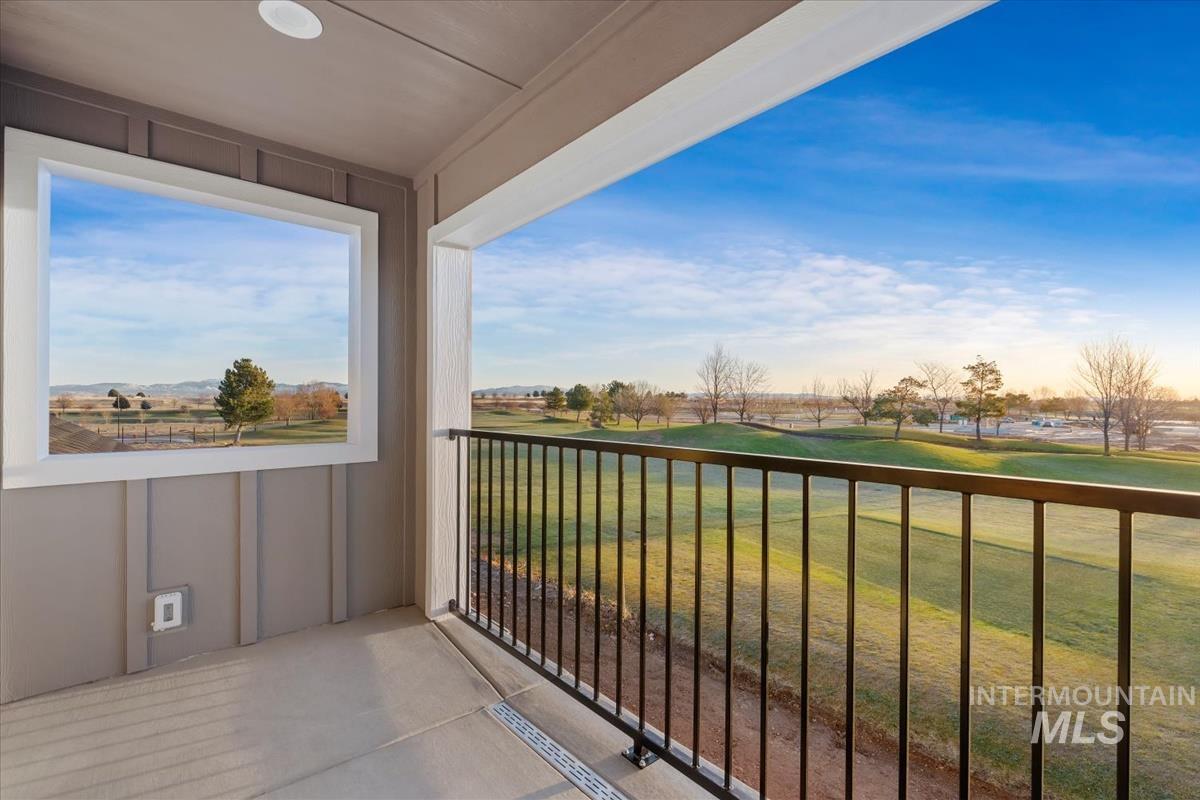 Balcony featuring view of golf course