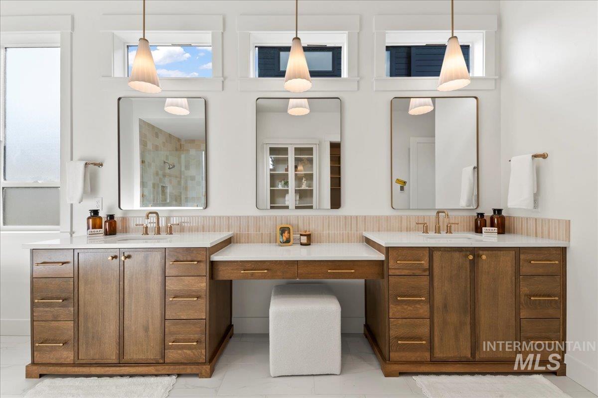 Full bath with a stall shower and vanity
