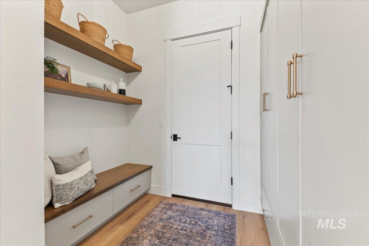 Mudroom with light wood finished floors