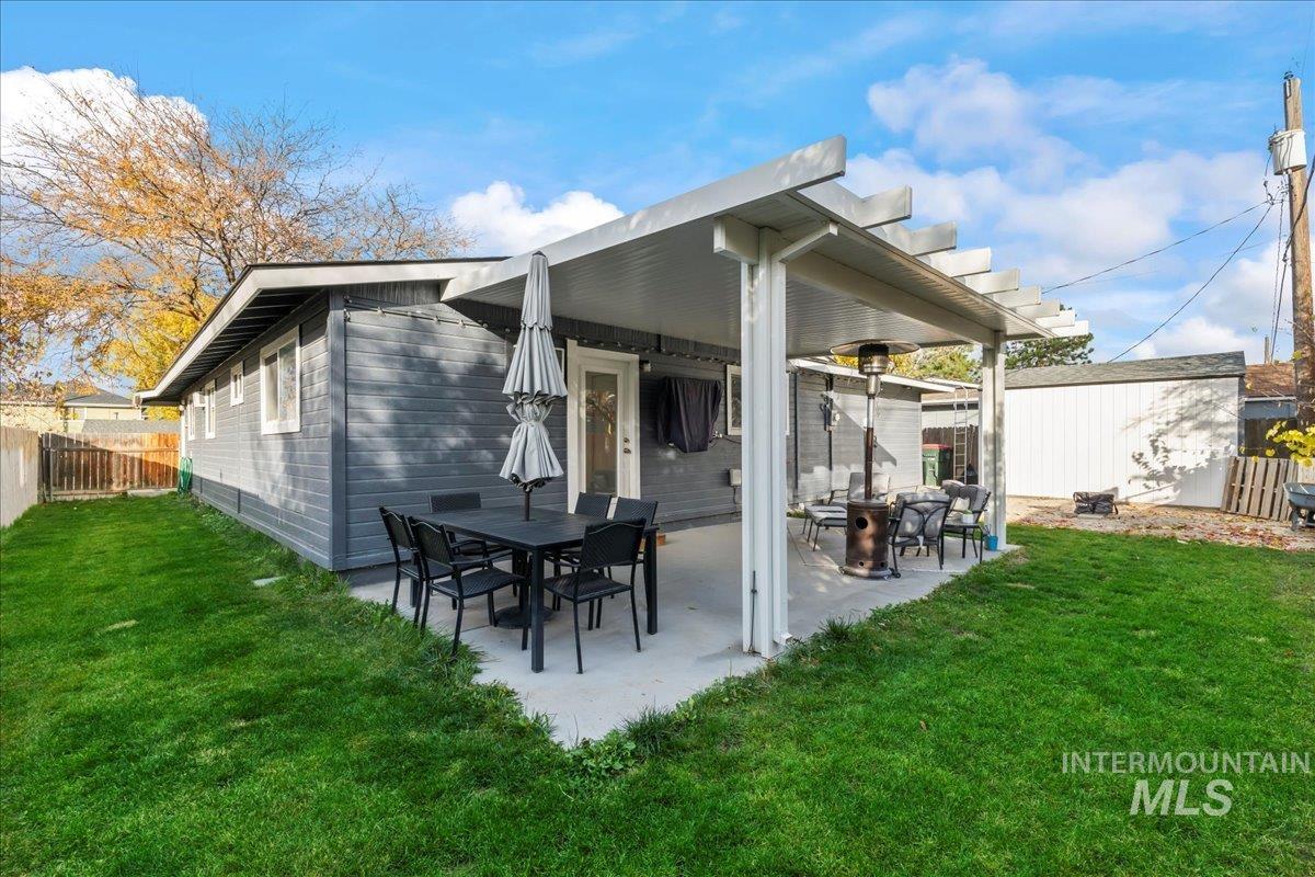 Rear view of property with a patio