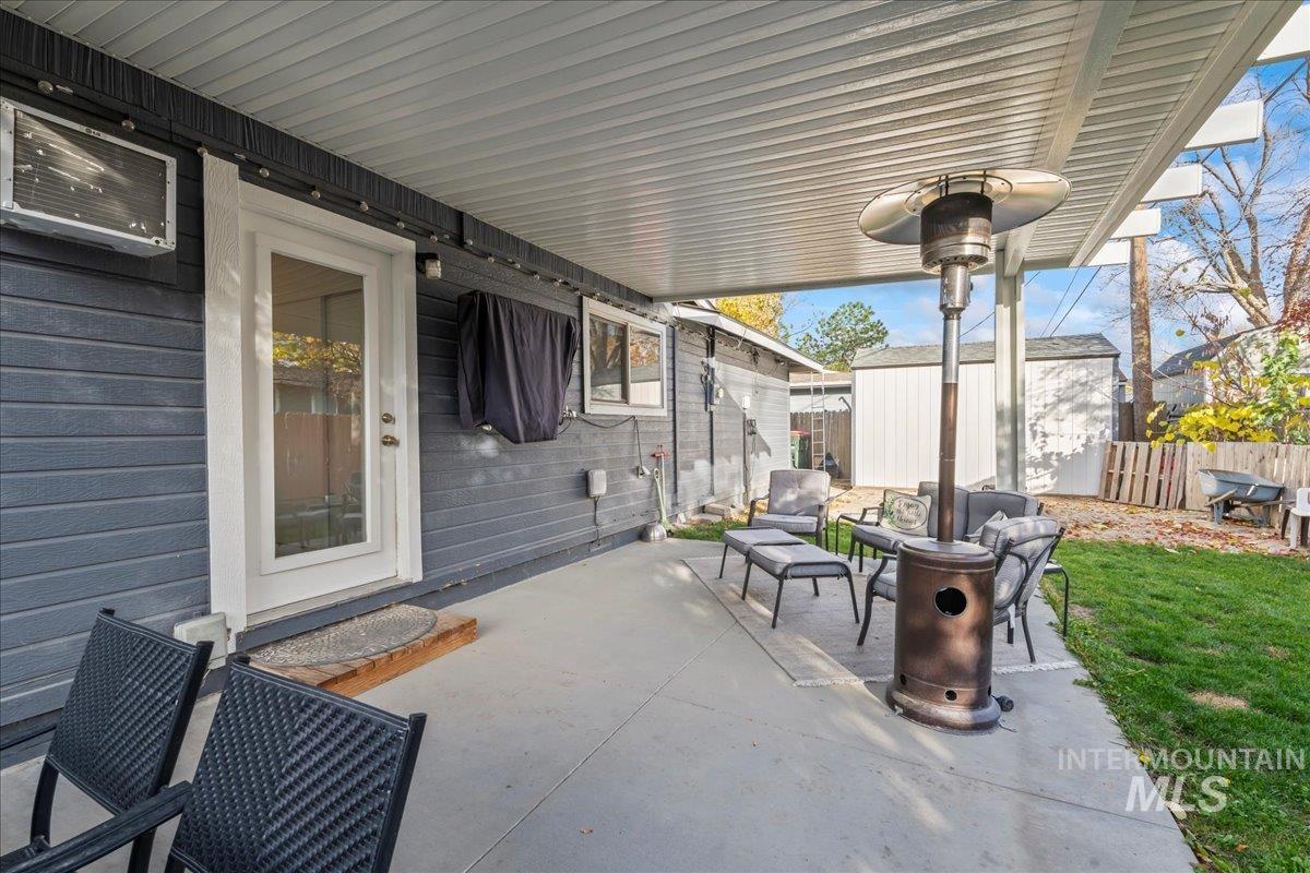 View of patio / terrace with a storage shed and an outdoor living space