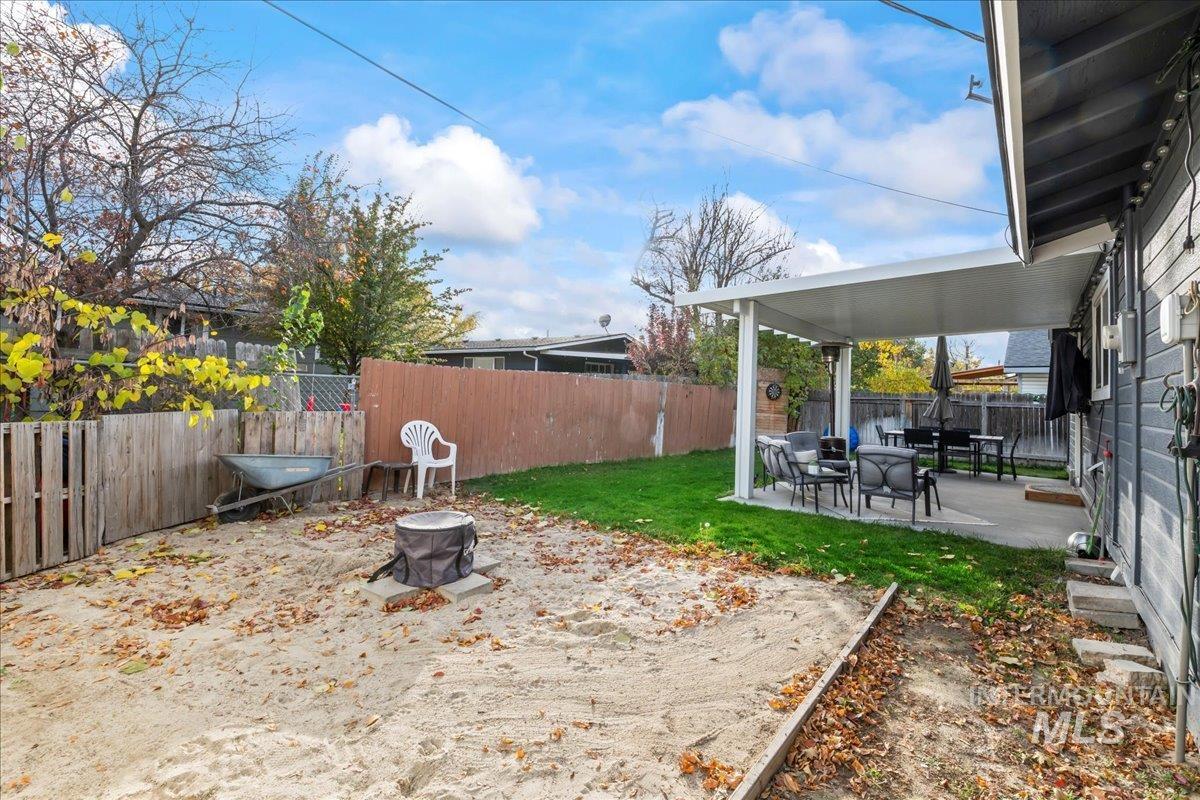 Fenced backyard featuring a patio area