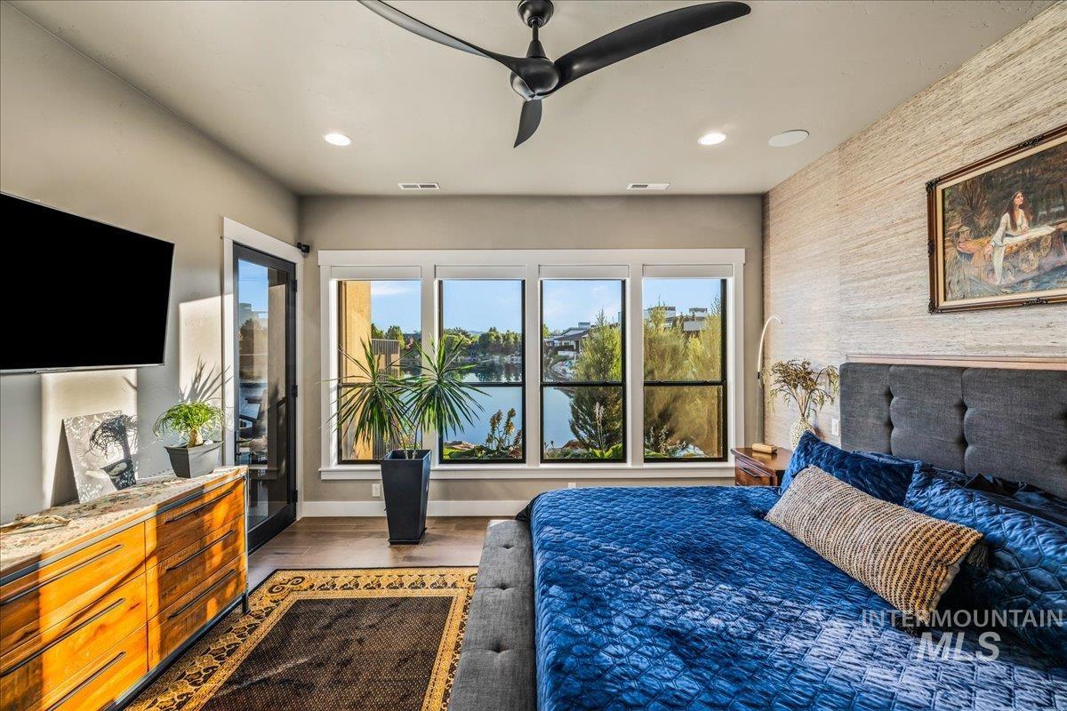 Bedroom featuring recessed lighting, wood finished floors, and ceiling fan