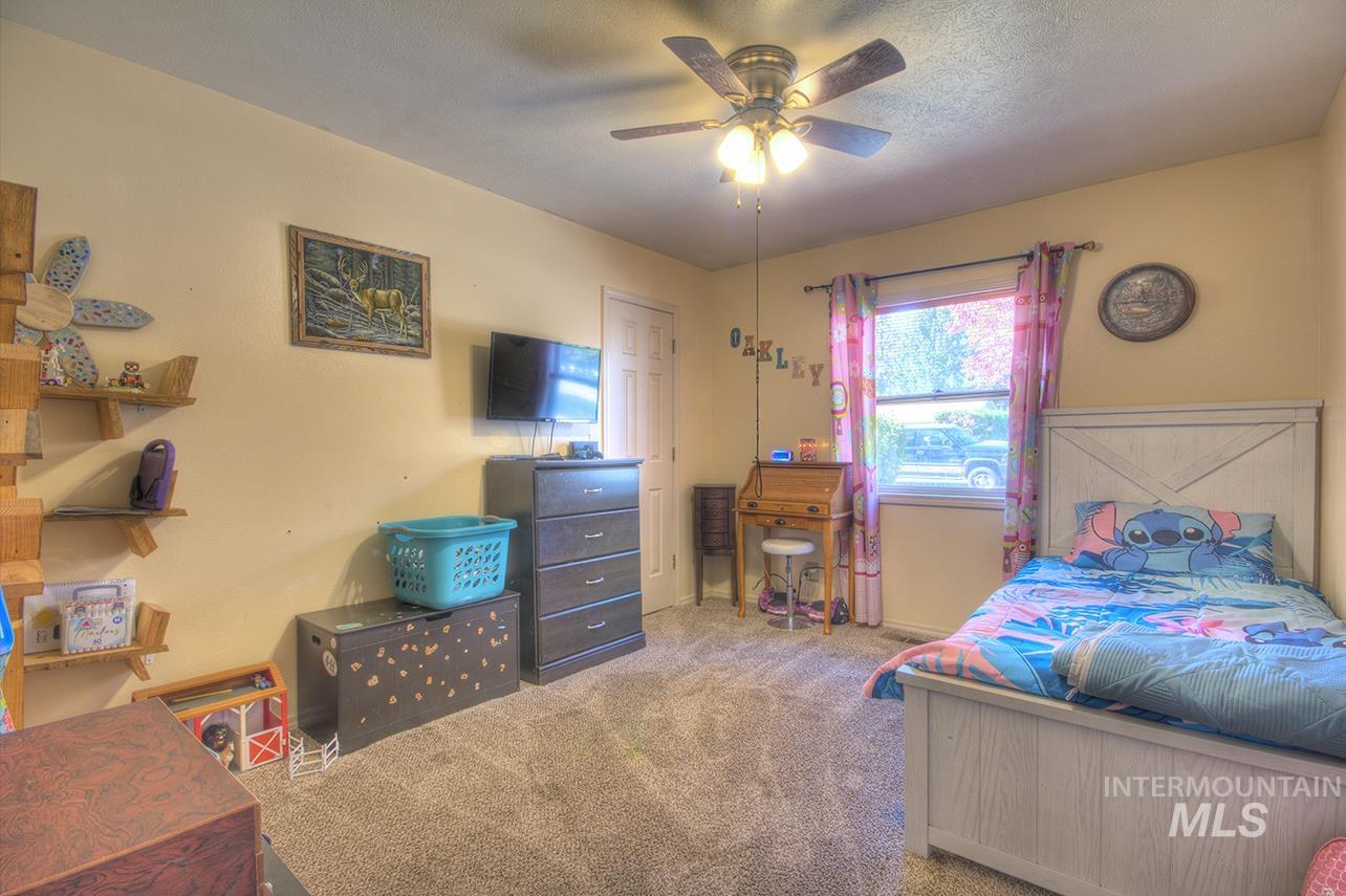Bedroom featuring carpet floors and a ceiling fan