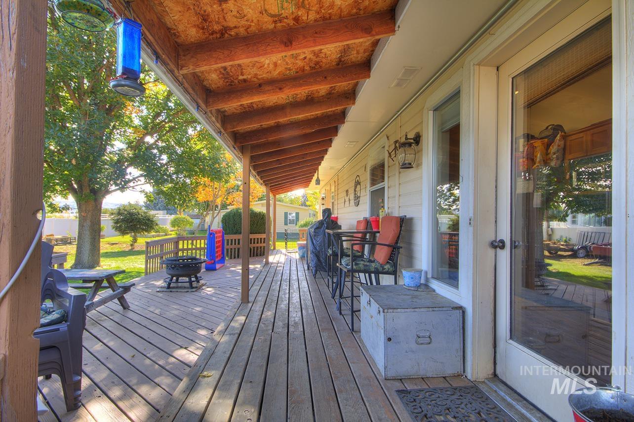Wooden deck featuring an outdoor fire pit