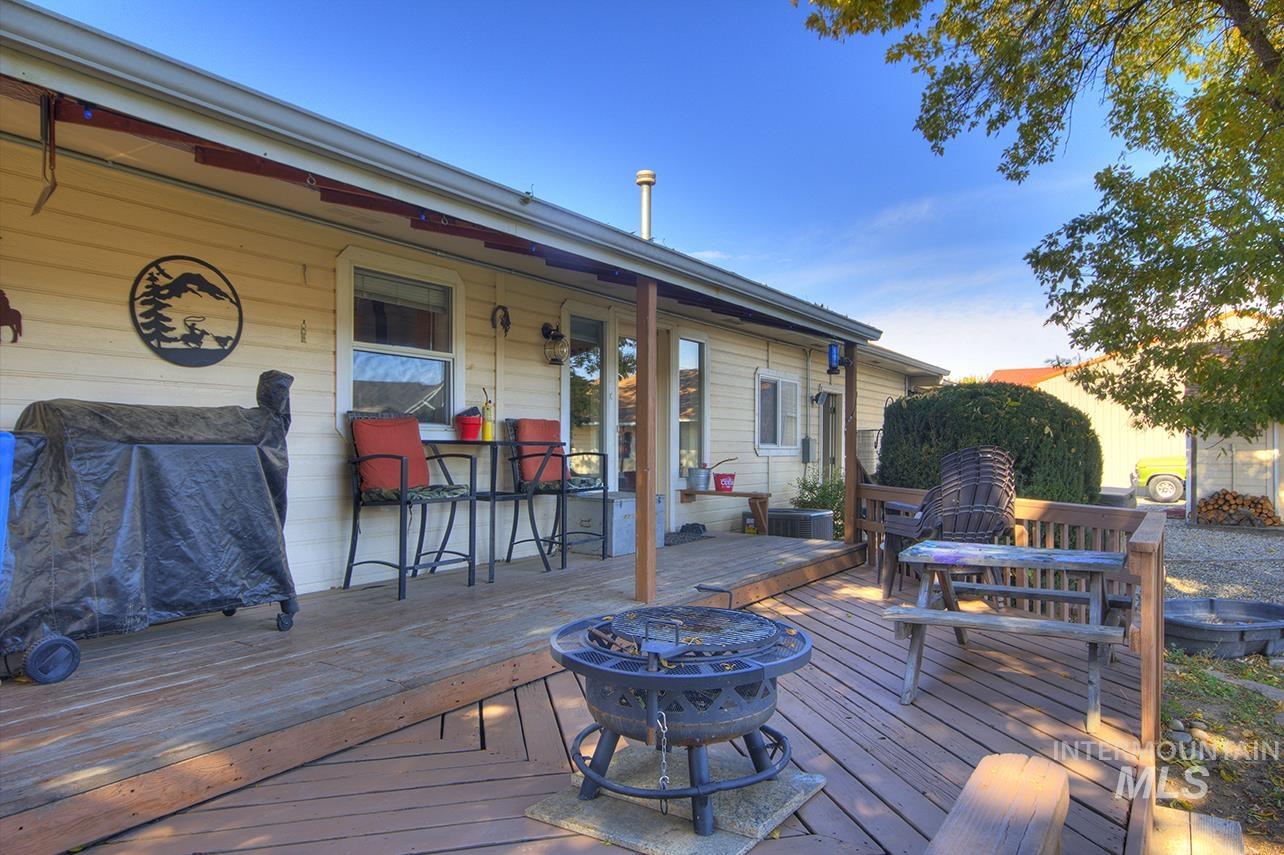 Wooden terrace featuring an outdoor fire pit