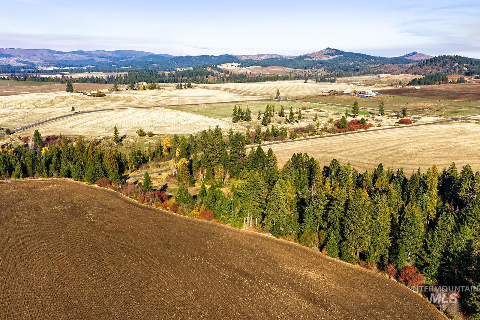 View of mountain backdrop with rural landscape