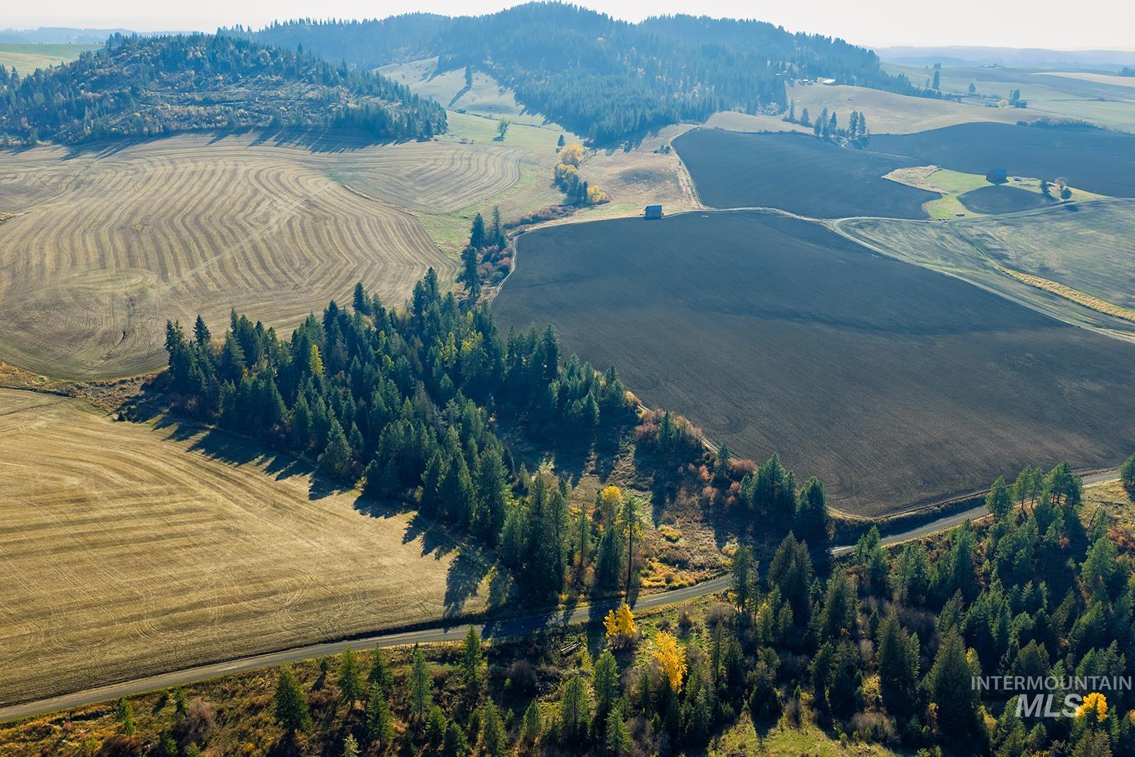 View of mountain background with rural landscape and farmland