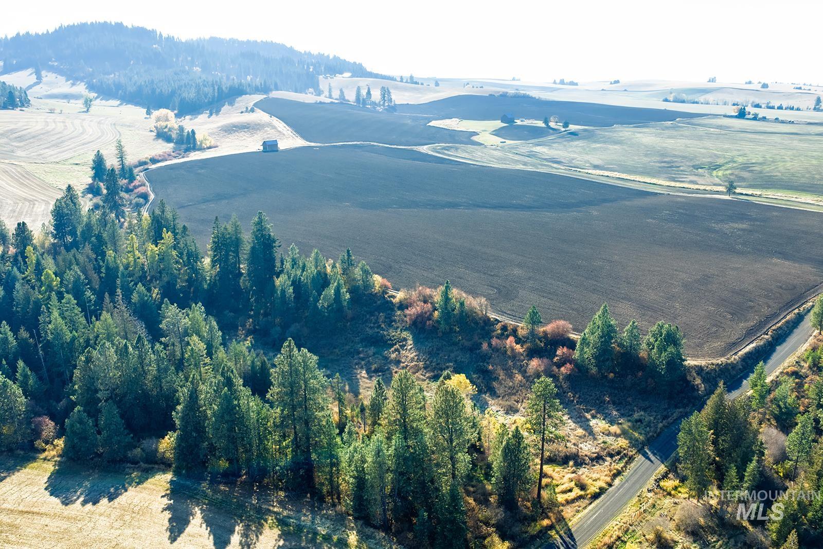 View of mountain backdrop with rural landscape