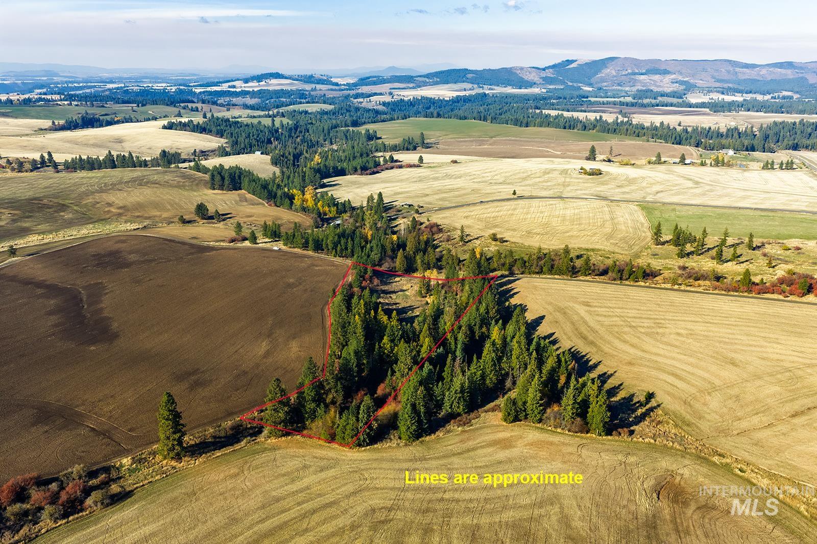 View of rural area with property boundaries highlighted and a mountainous background