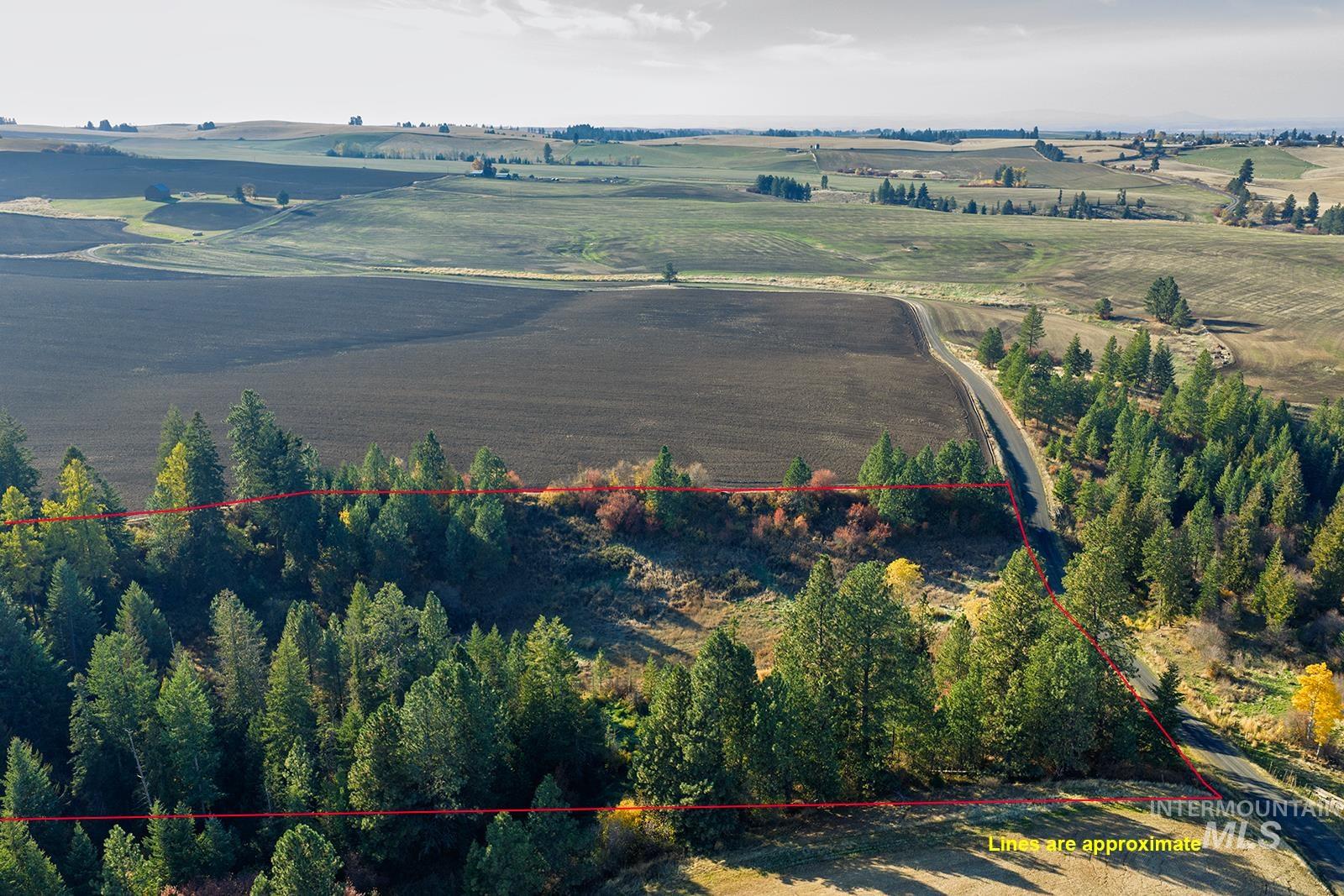 Aerial view of sparsely populated area with property boundaries highlighted