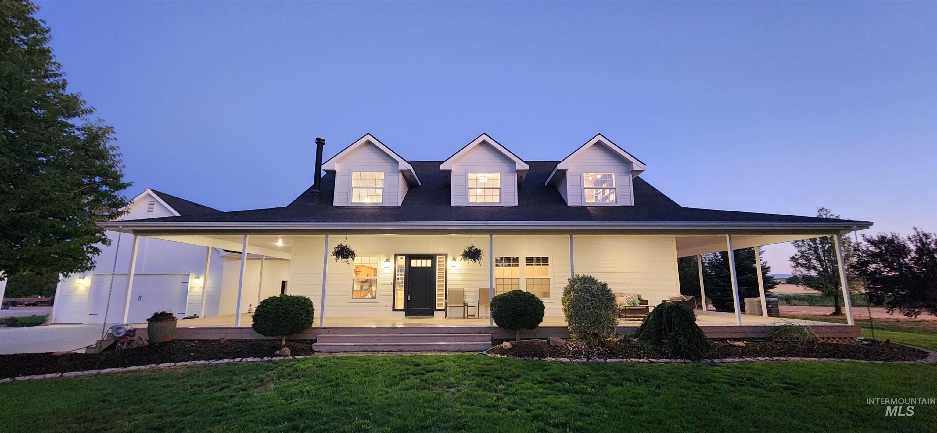 View of front of home featuring a porch and a front yard