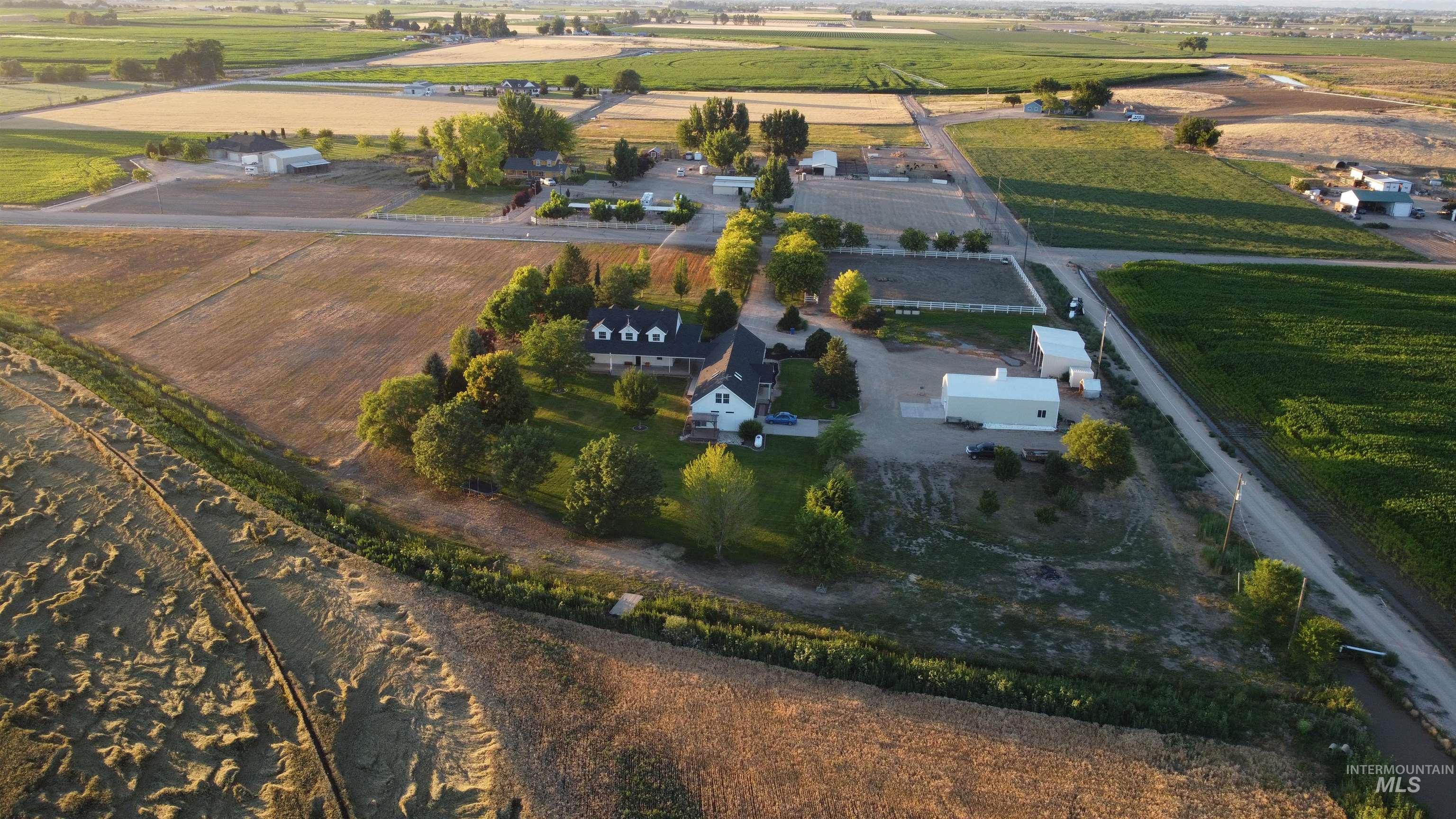 Aerial view of property's location with rural landscape and extensive farmland