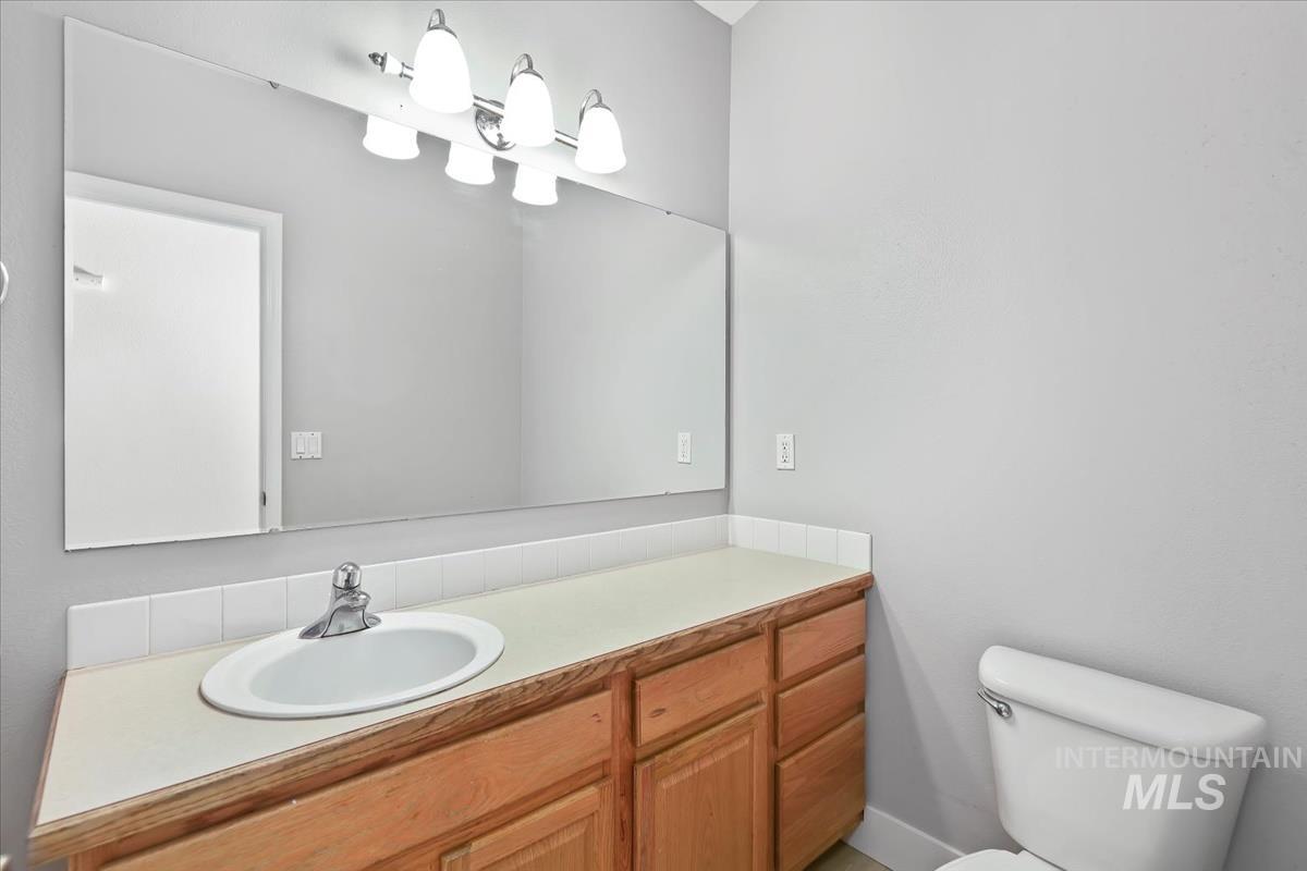 Bathroom featuring vanity and toilet