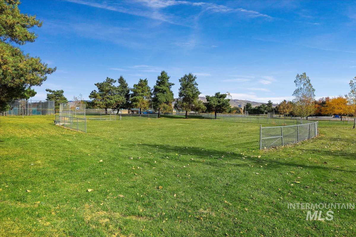 View of yard featuring an area for soccer, a view of countryside, and a mountain view