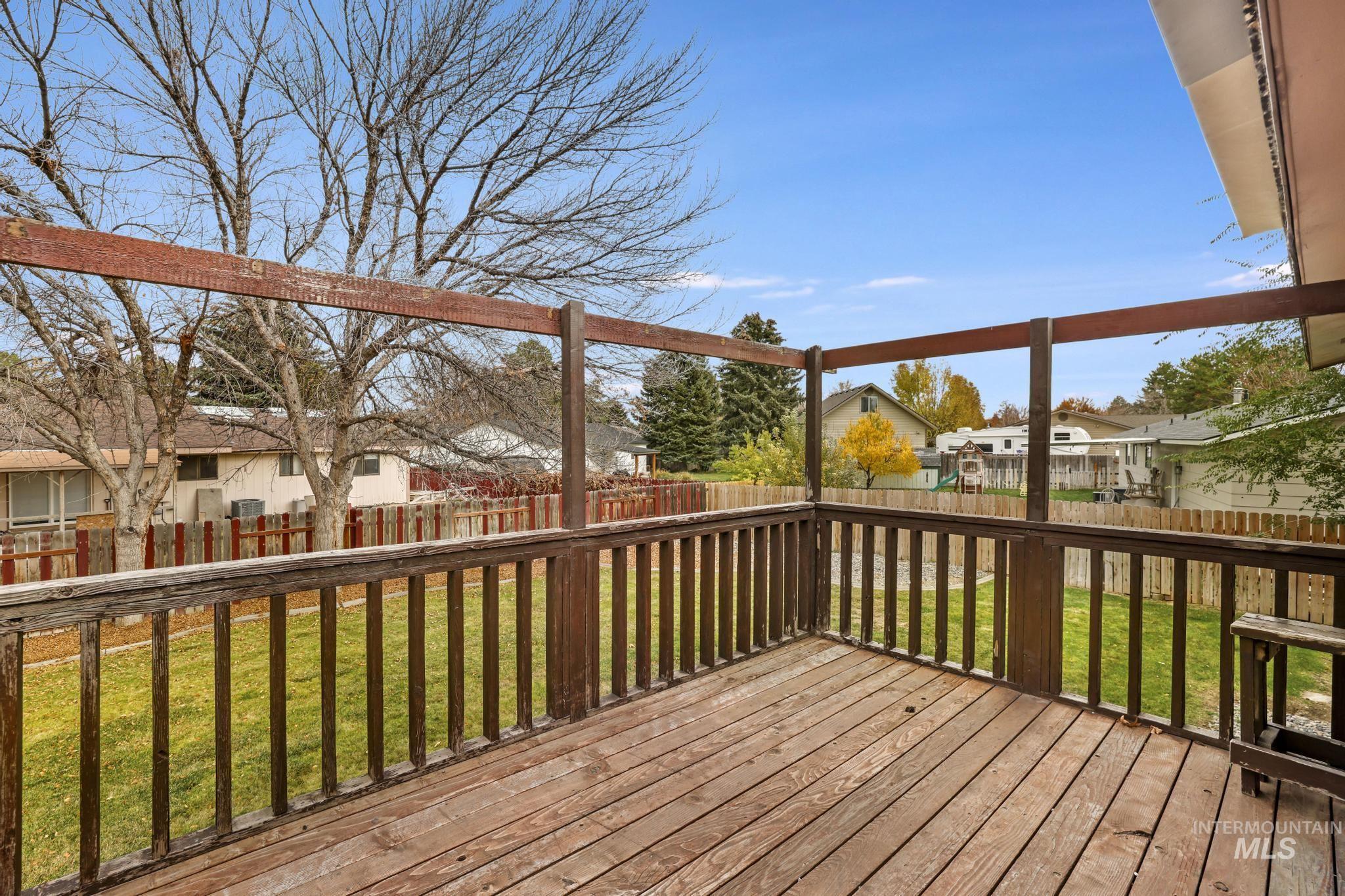 Deck featuring a residential view and a fenced backyard