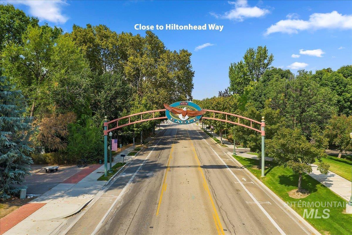 View of asphalt street featuring sidewalks