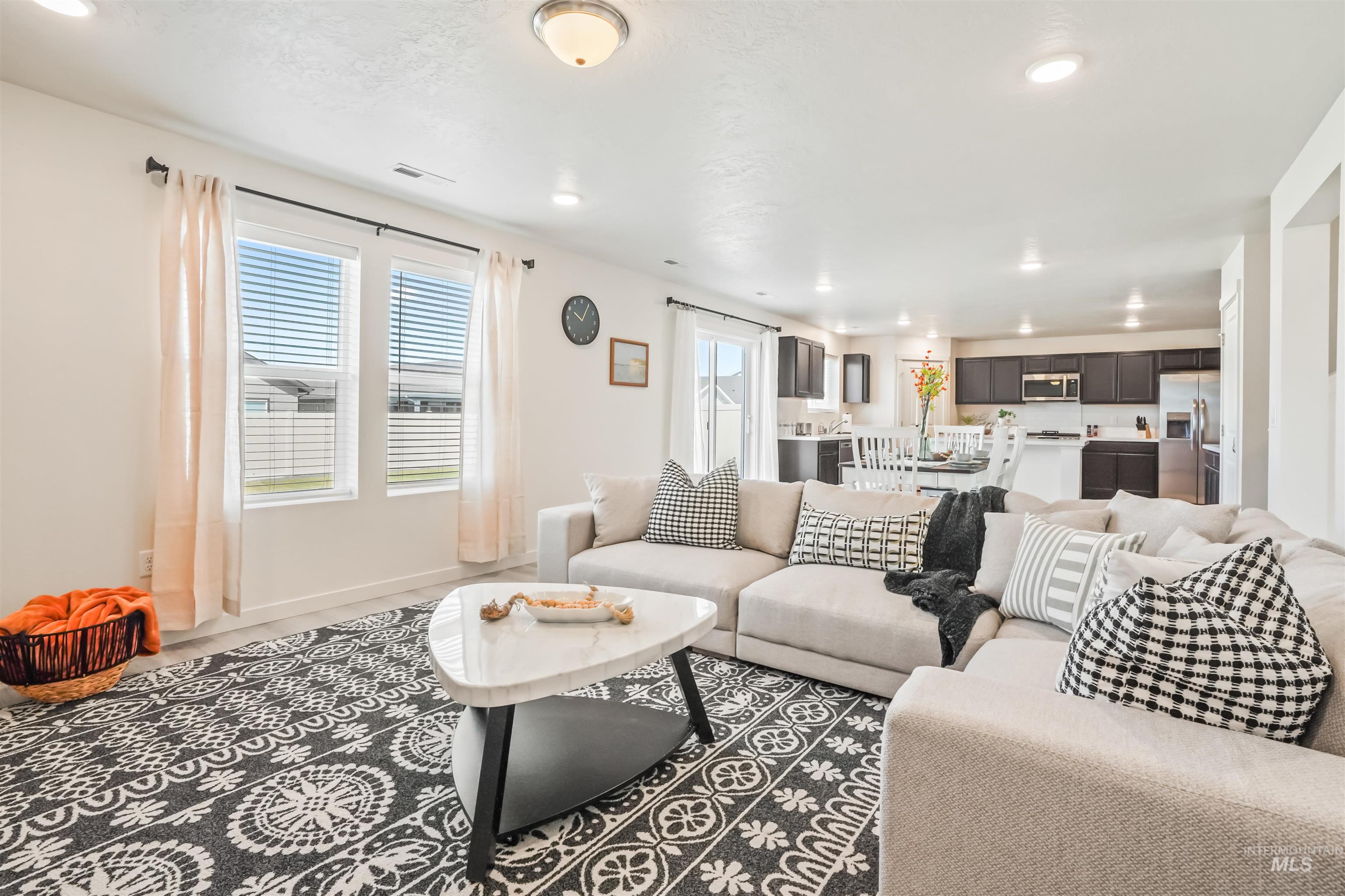 Living room featuring recessed lighting and baseboards