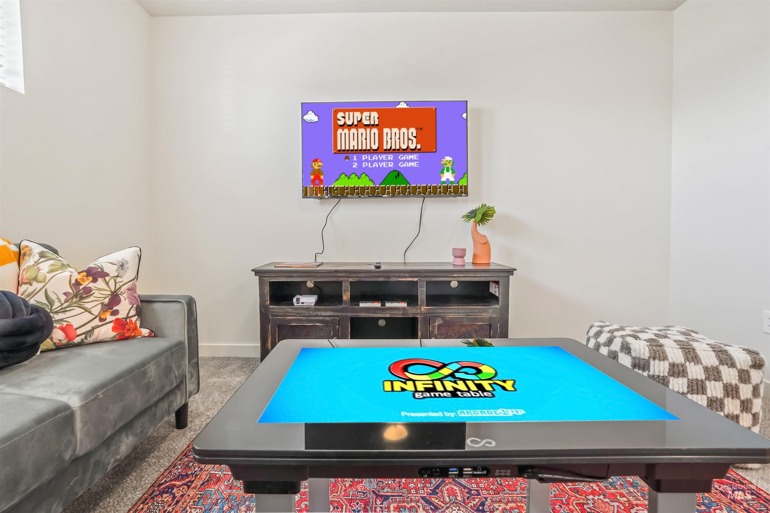 Rec room with carpet floors and baseboards