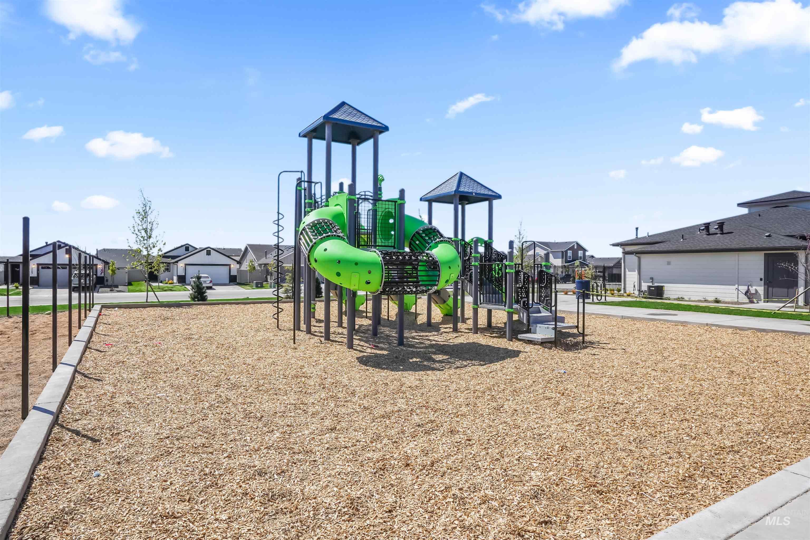 Community jungle gym with a residential view