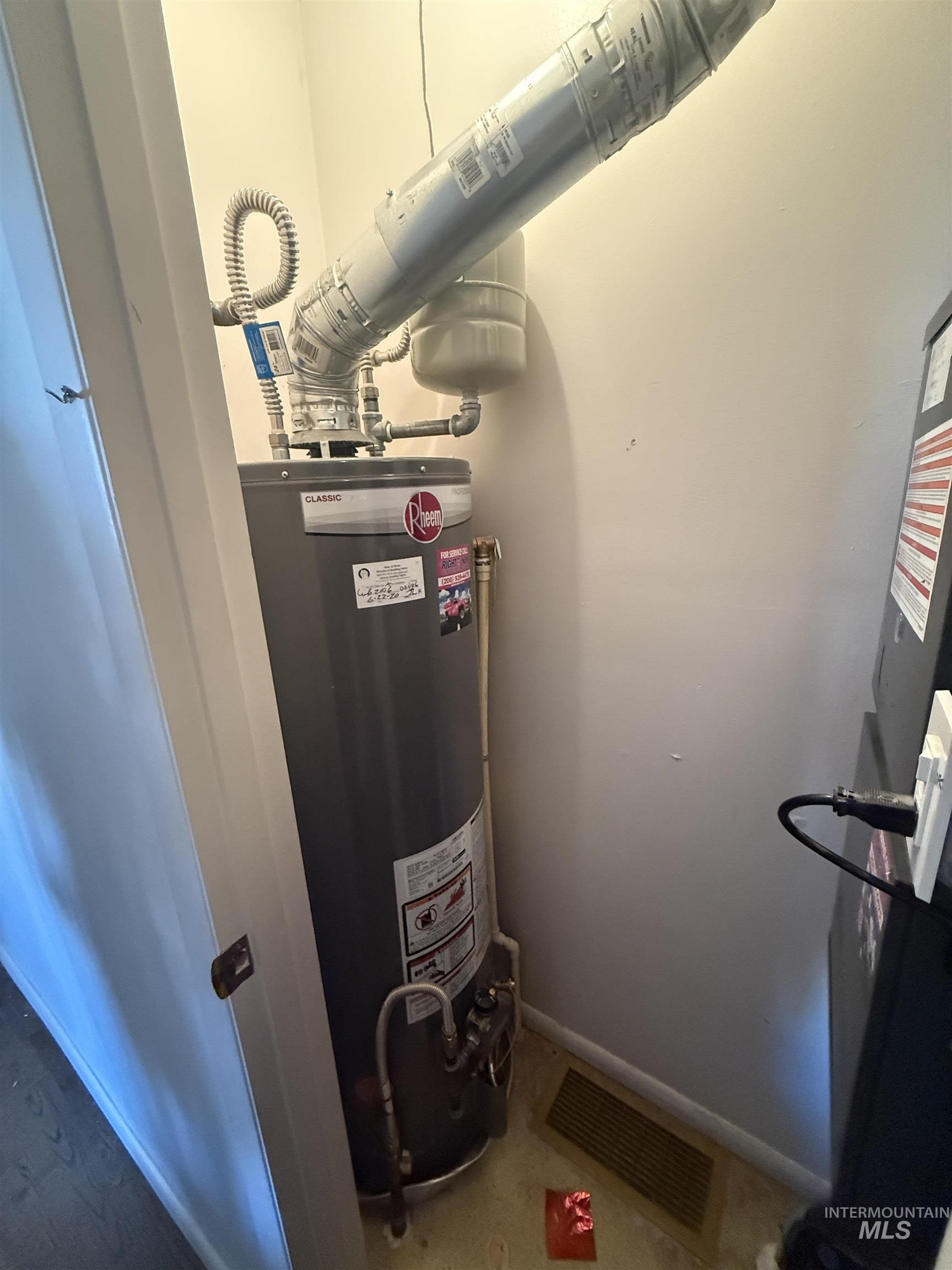 Utility room featuring gas water heater