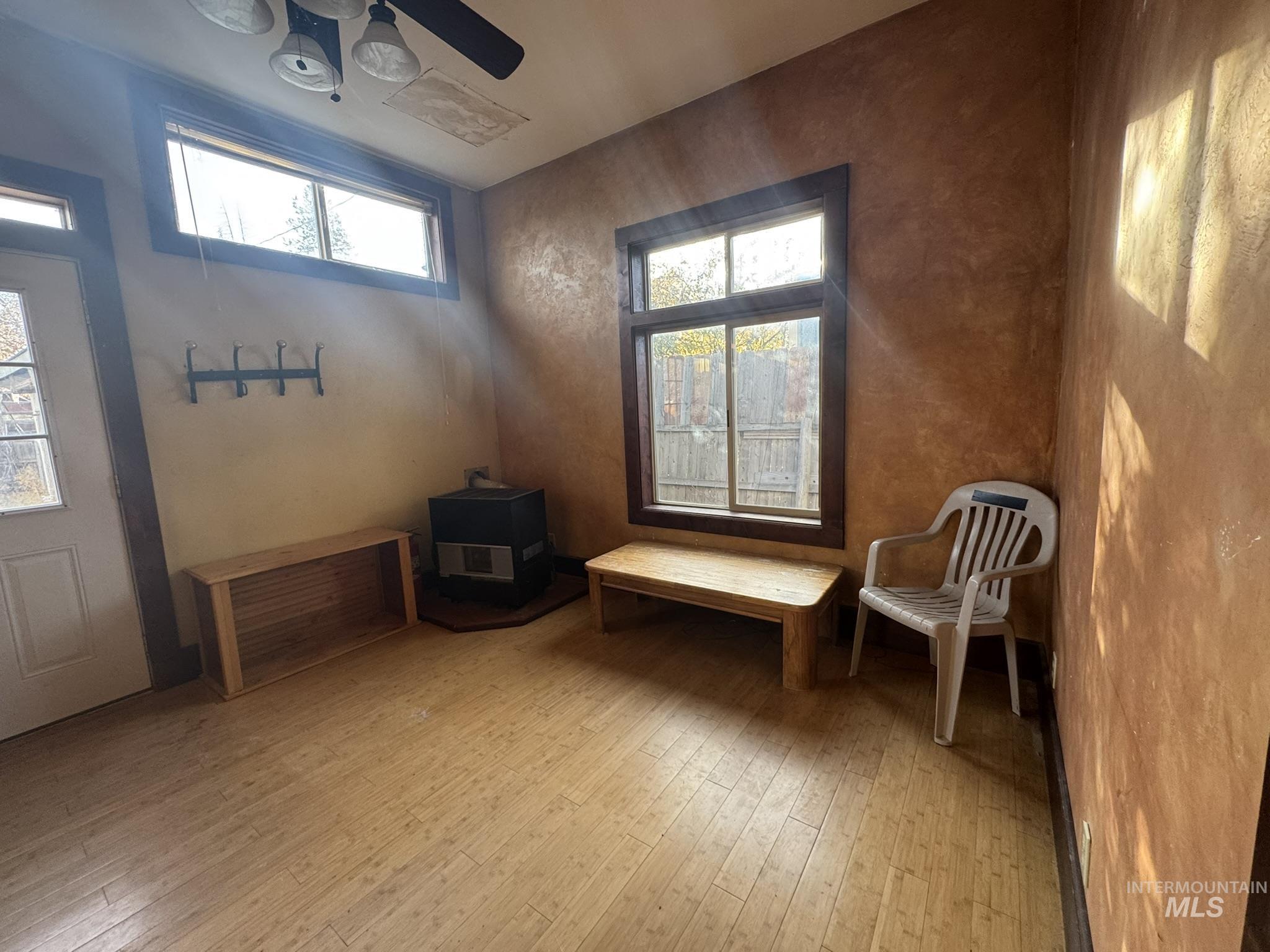 Unfurnished room with light wood-style floors and ceiling fan