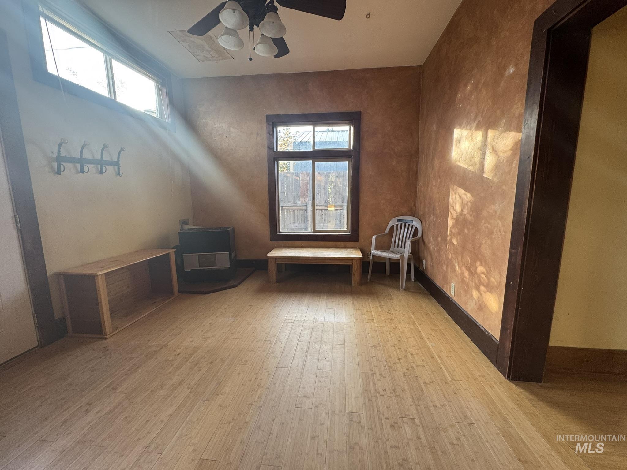 Unfurnished room with light wood-style flooring and ceiling fan