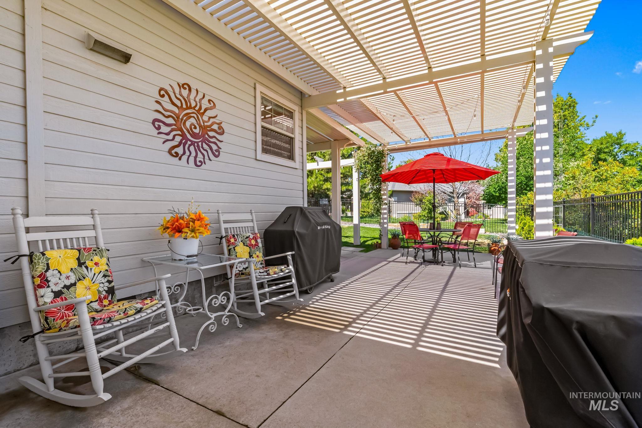 View of patio / terrace with a pergola, grilling area, and outdoor dining space