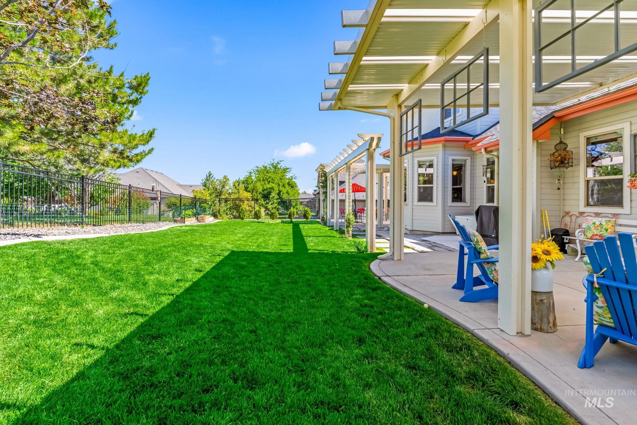 Fenced backyard with a patio area