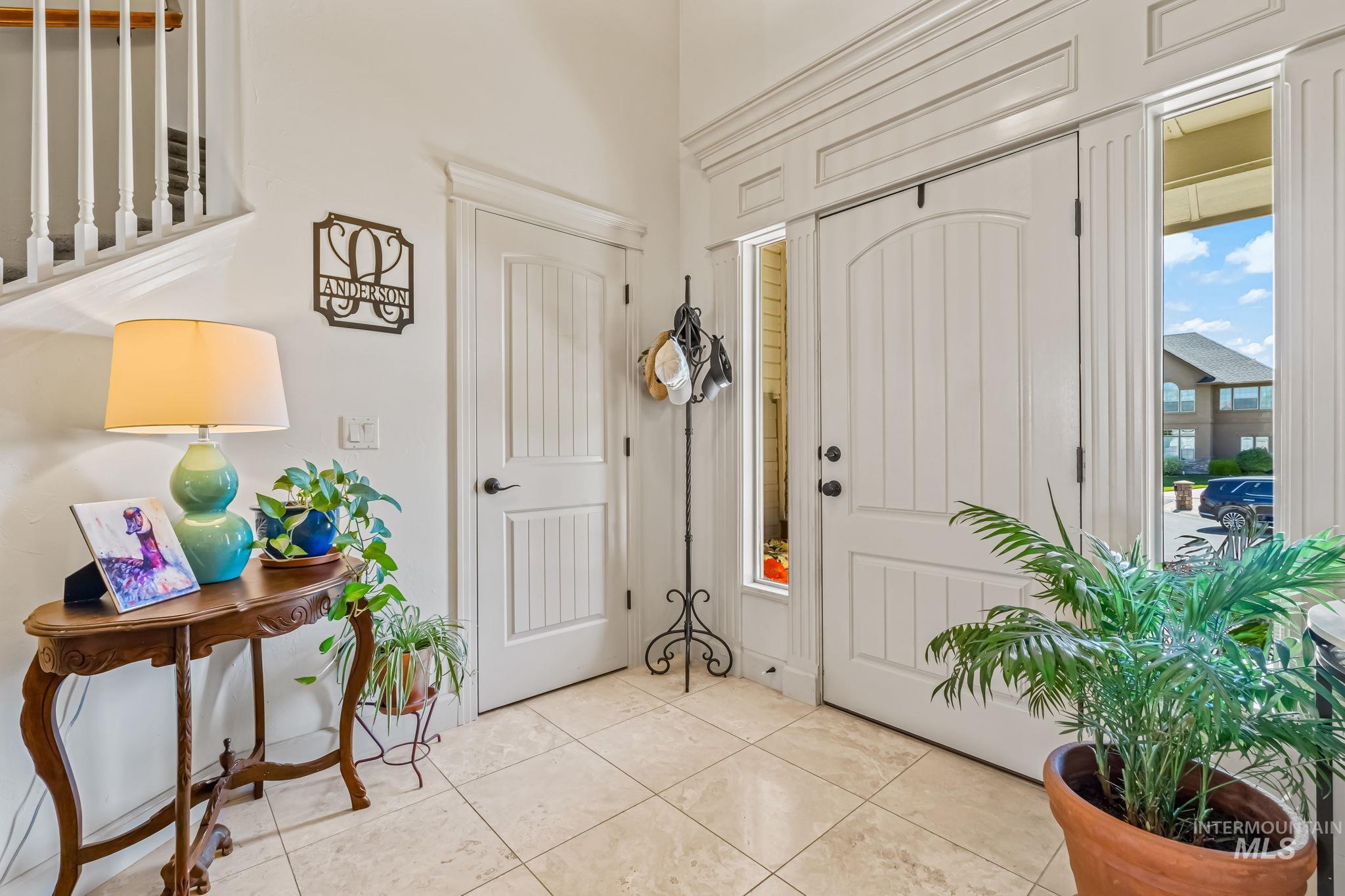 Foyer featuring light tile patterned floors