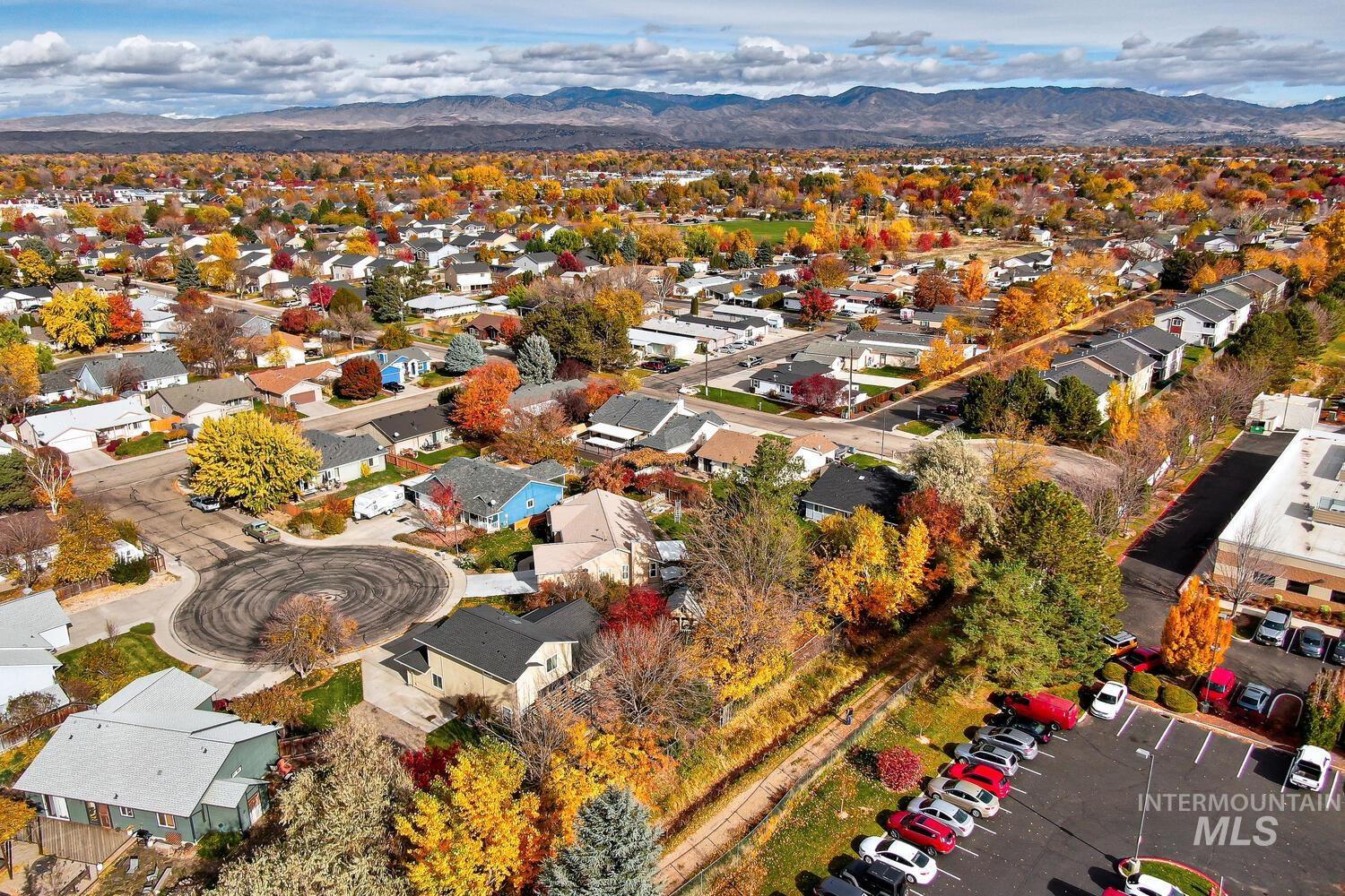 Aerial view of residential area featuring mountains