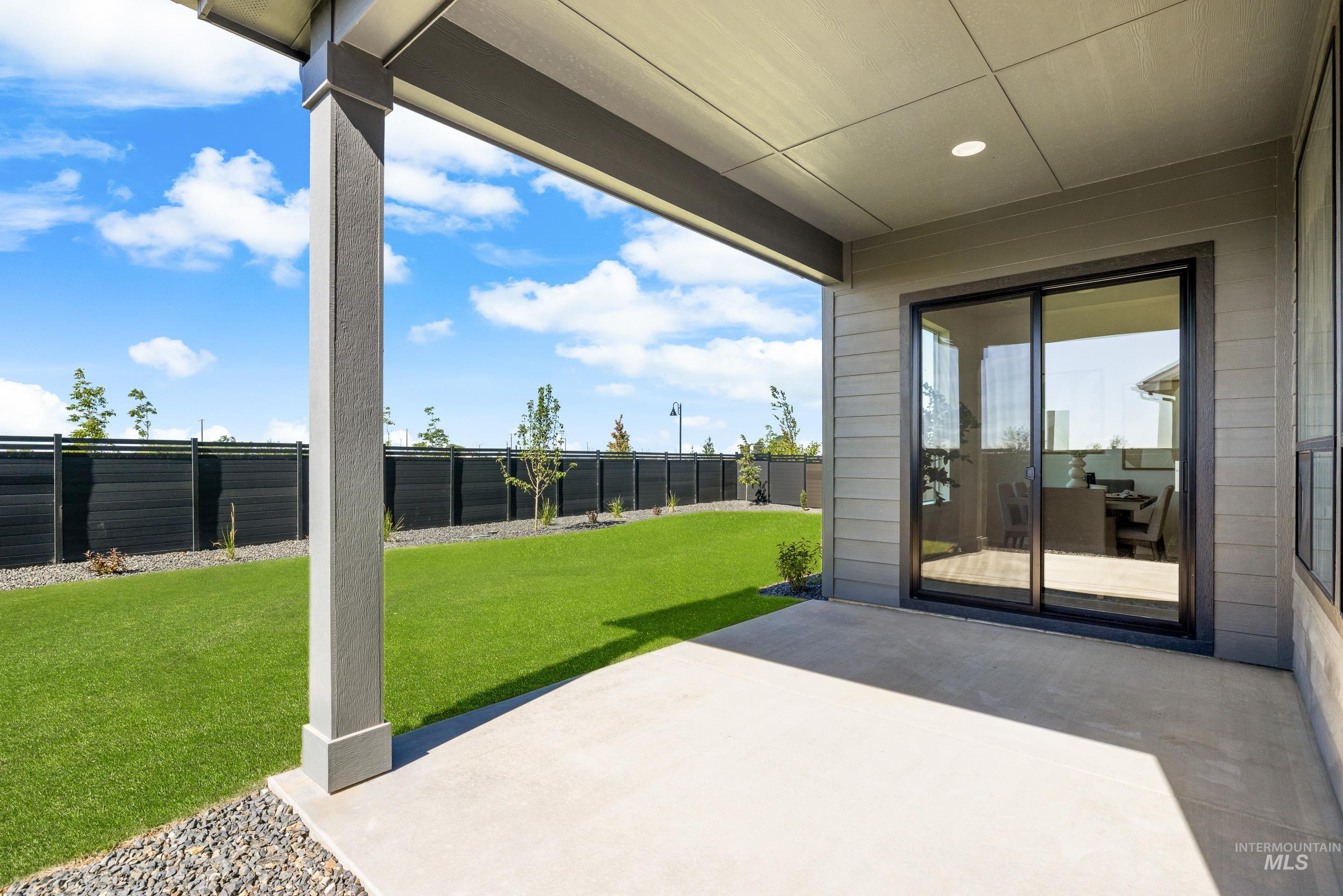 Fenced backyard featuring a patio area