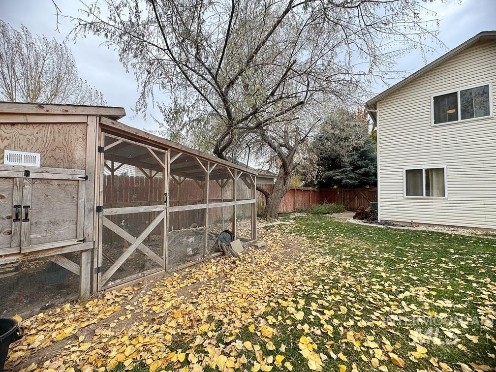 View of yard featuring an outdoor structure and exterior structure