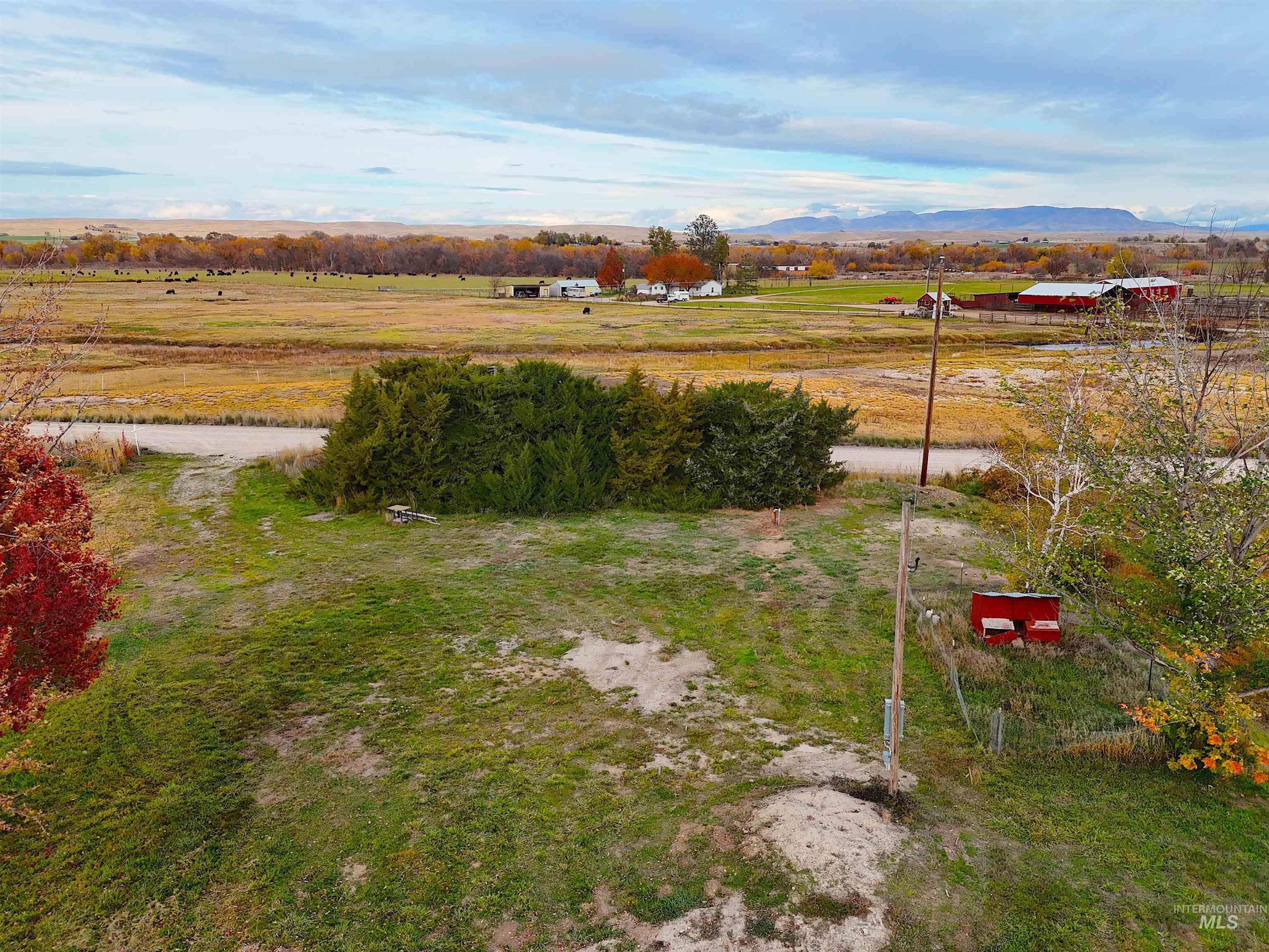 View of yard featuring a view of rural / pastoral area and a mountain view