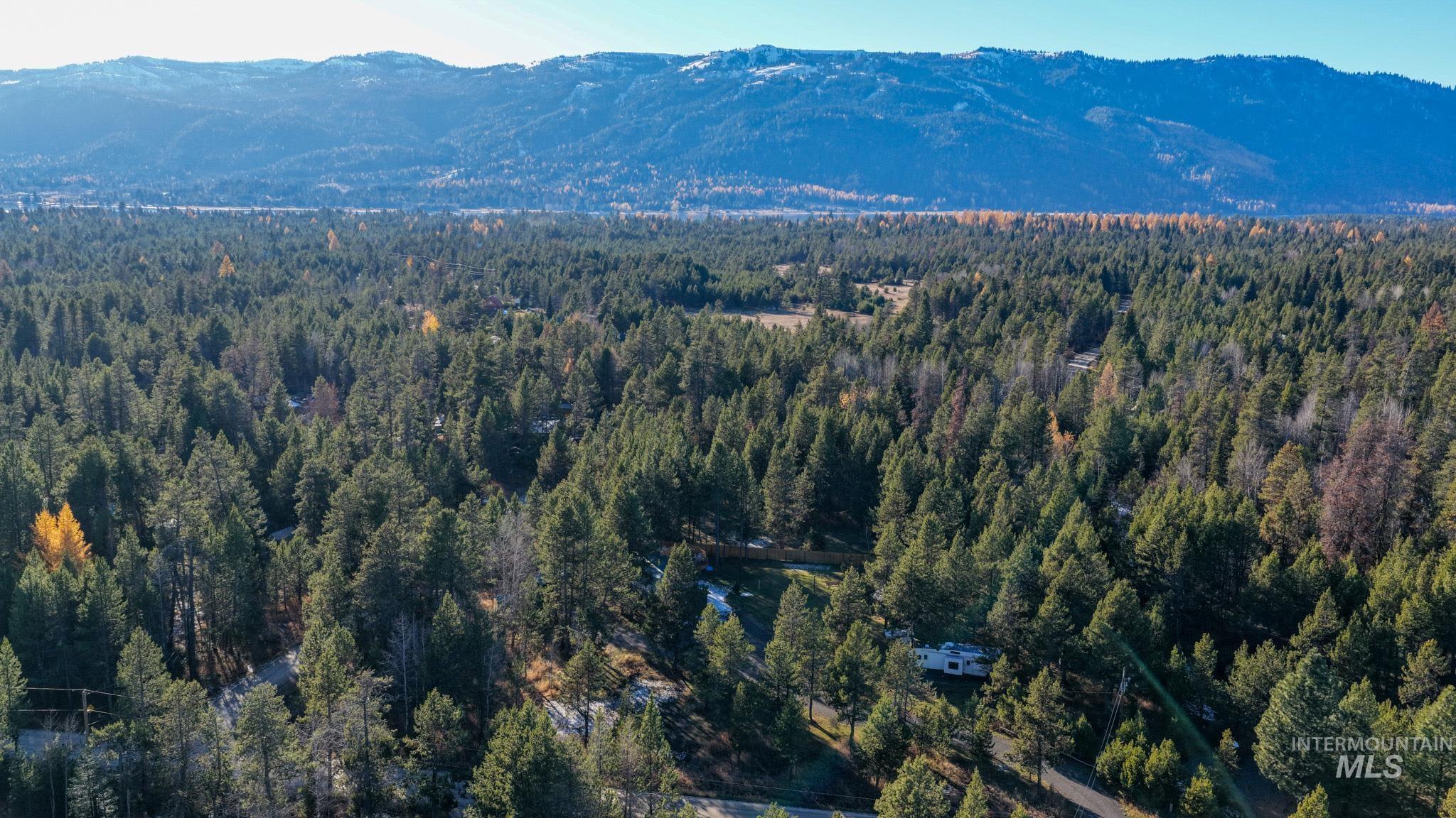 Aerial overview of property's location with a mountainous background