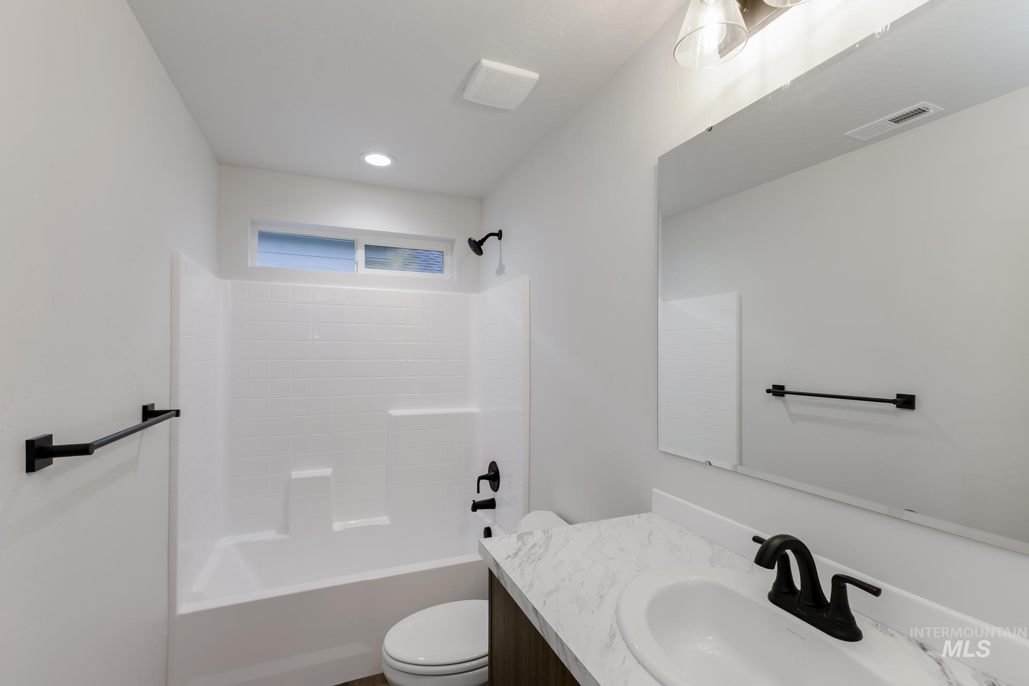 Full bath with shower / bathtub combination and vanity