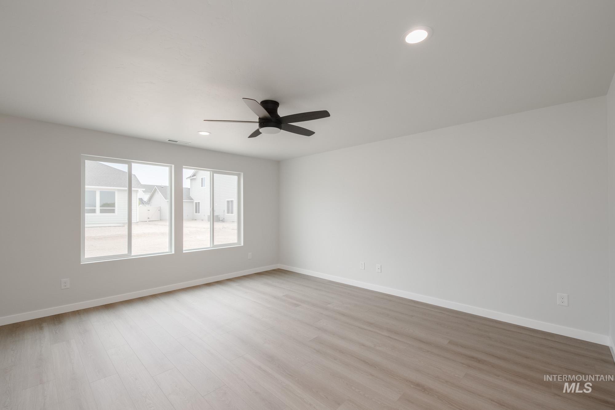 Unfurnished room featuring light wood-style floors, recessed lighting, and a ceiling fan