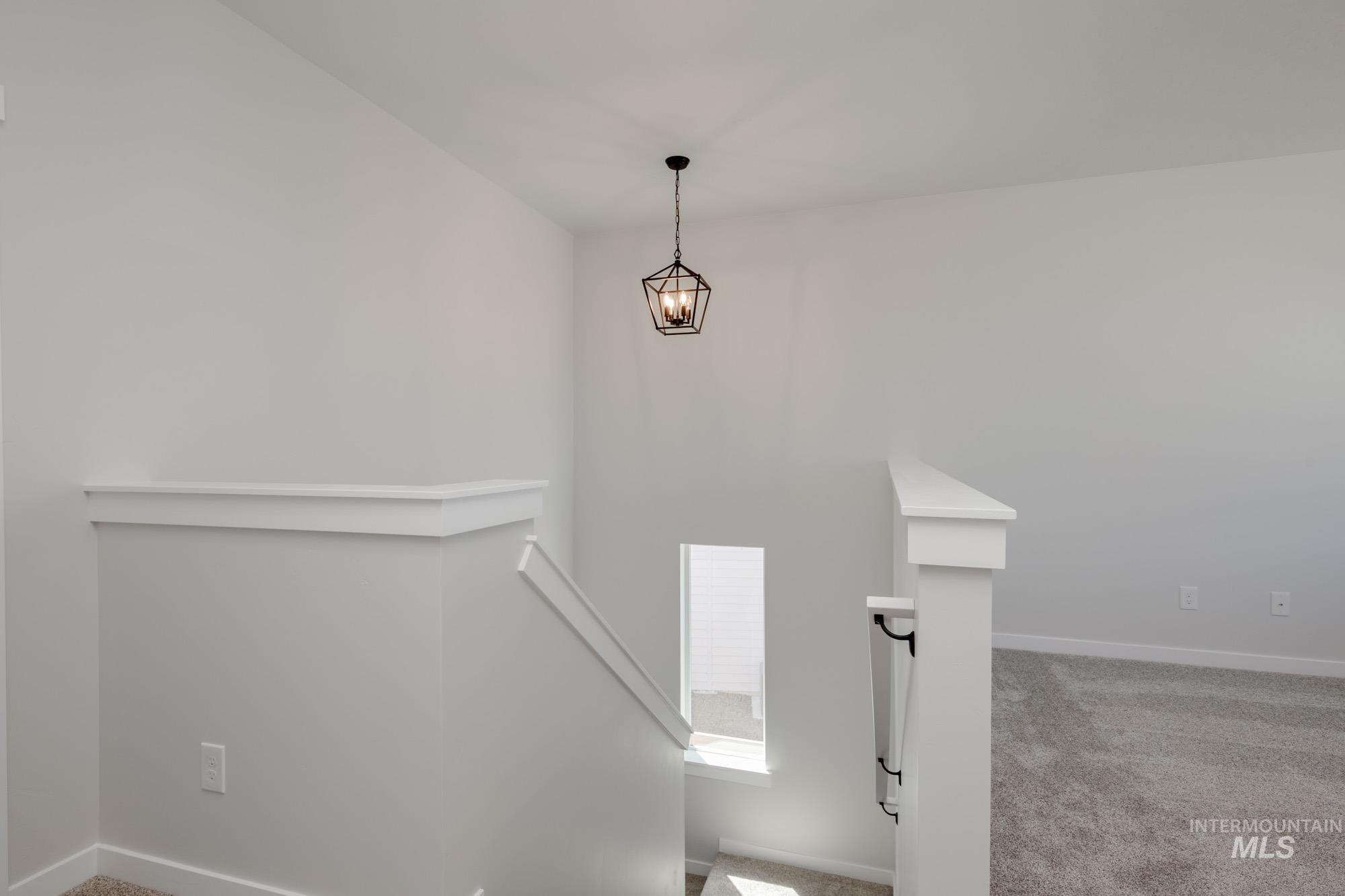 Stairs with carpet and baseboards