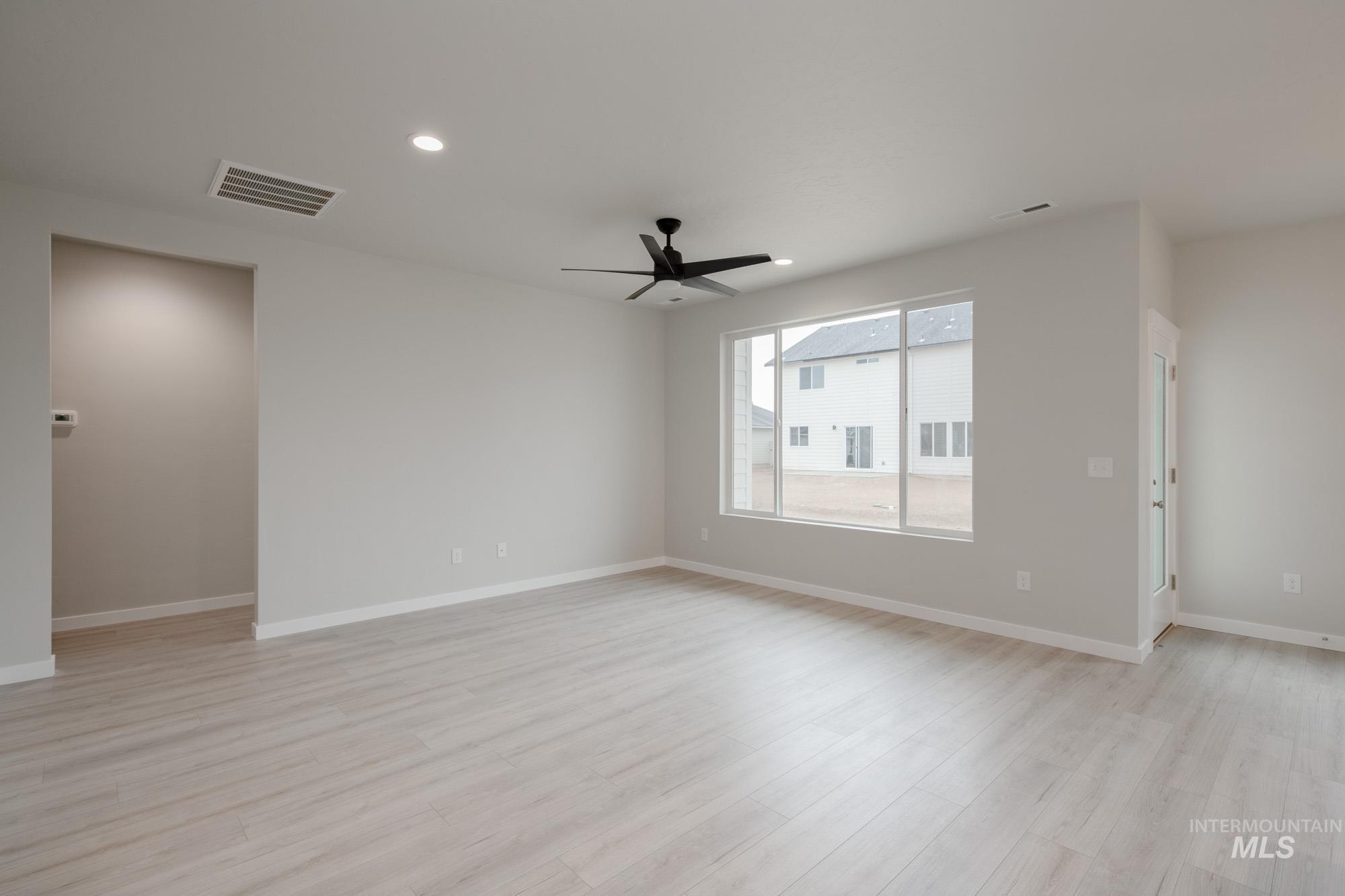 Unfurnished room with recessed lighting, light wood-style flooring, and ceiling fan