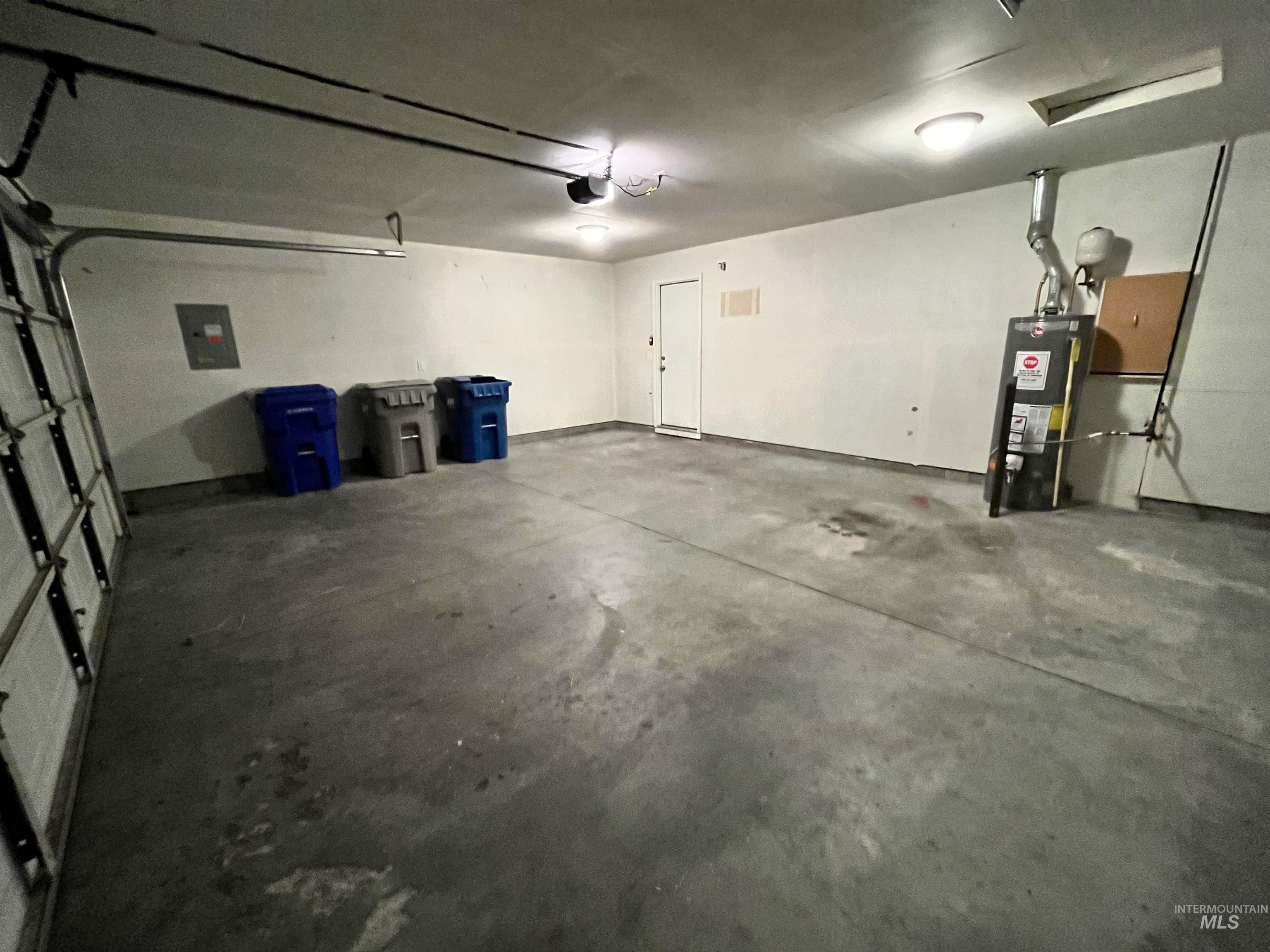 Garage with electric panel and water heater