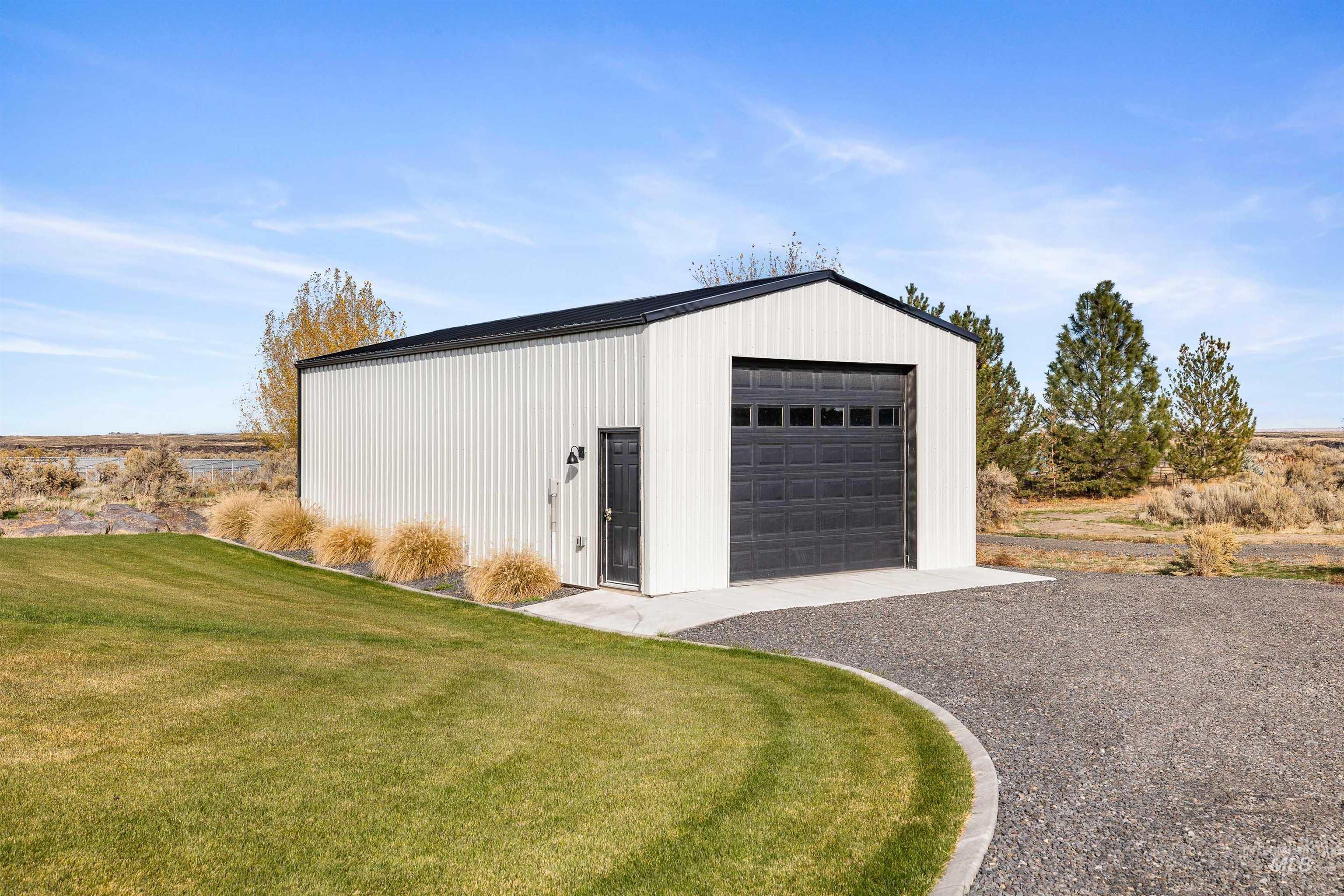 Detached shop with gravel driveway