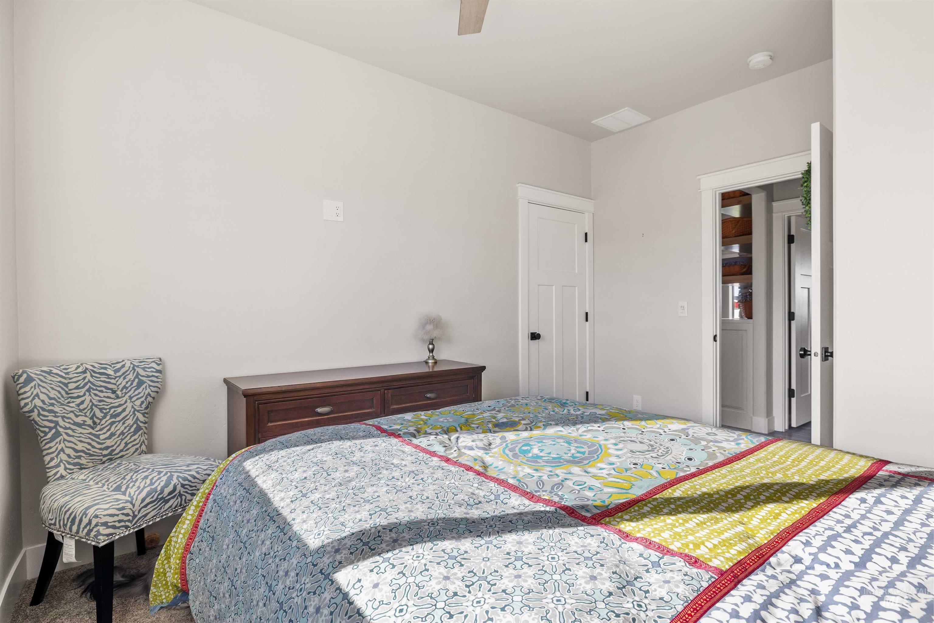 Bedroom featuring carpet floors and ceiling fan