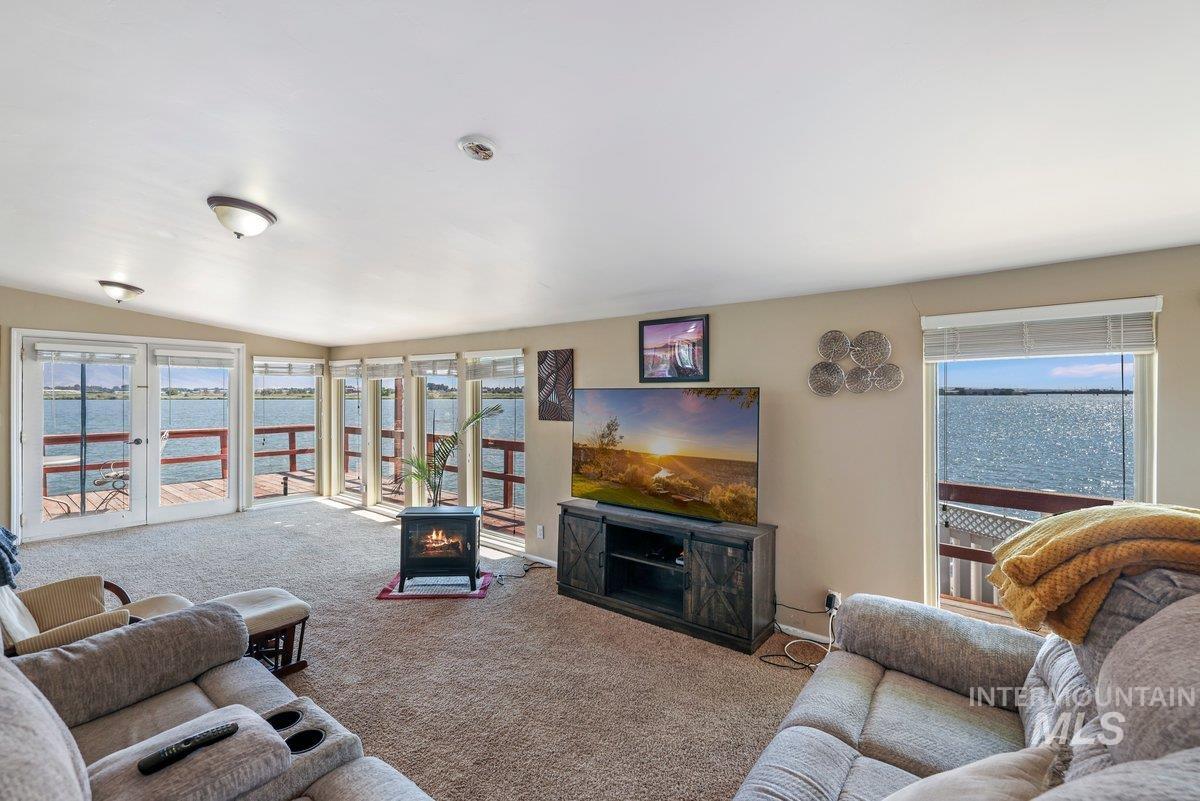 Carpeted living room featuring a fireplace