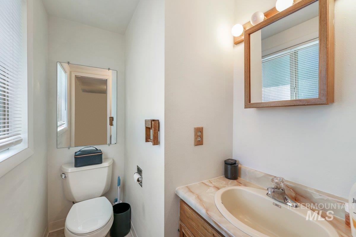 Bathroom with healthy amount of natural light and vanity