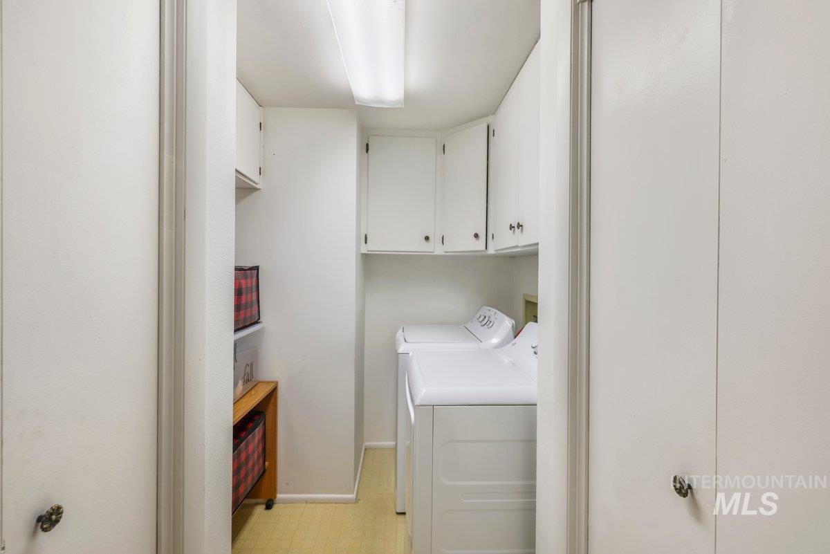 Laundry room with cabinet space and independent washer and dryer