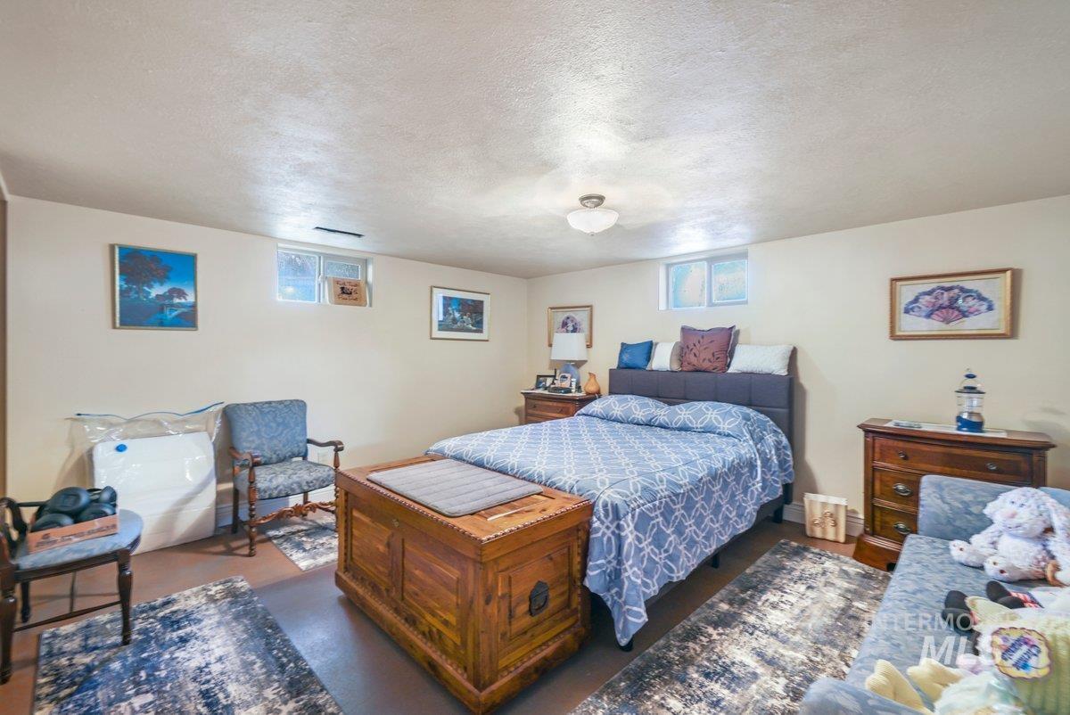 Bedroom with a textured ceiling